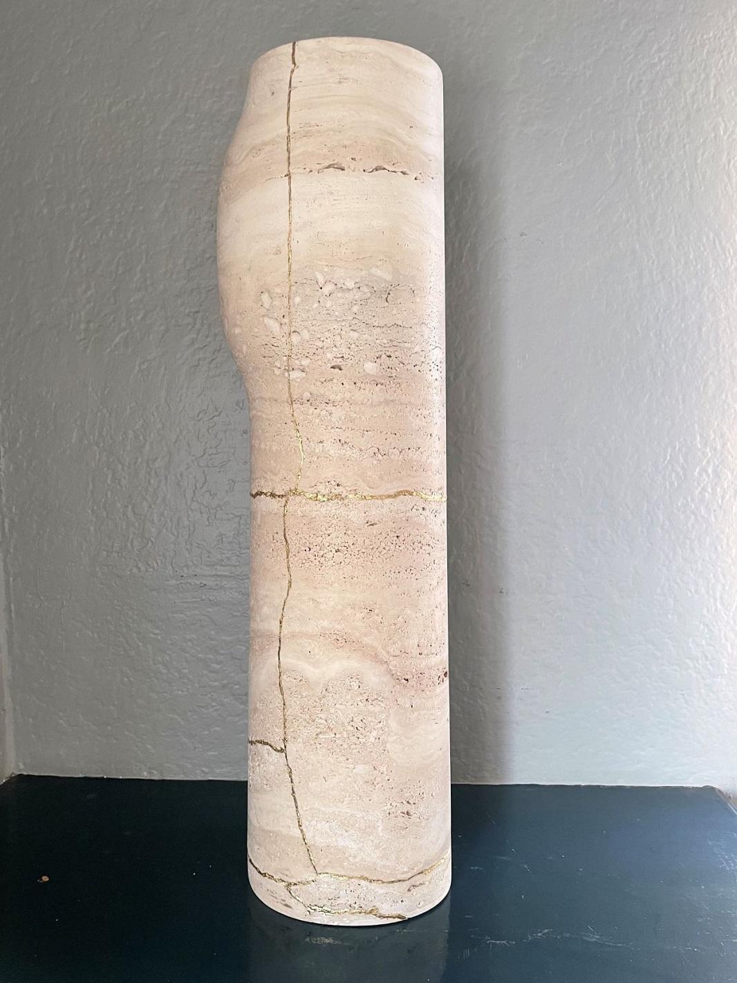 Absolutely beautiful and rare Roman Travertine vase by famed designer Christophe Delcourt for Collection Particuliere. Sculpted from the finest travertine found in Italian quarries; tall column vase with distinct protruding bulge towards the top