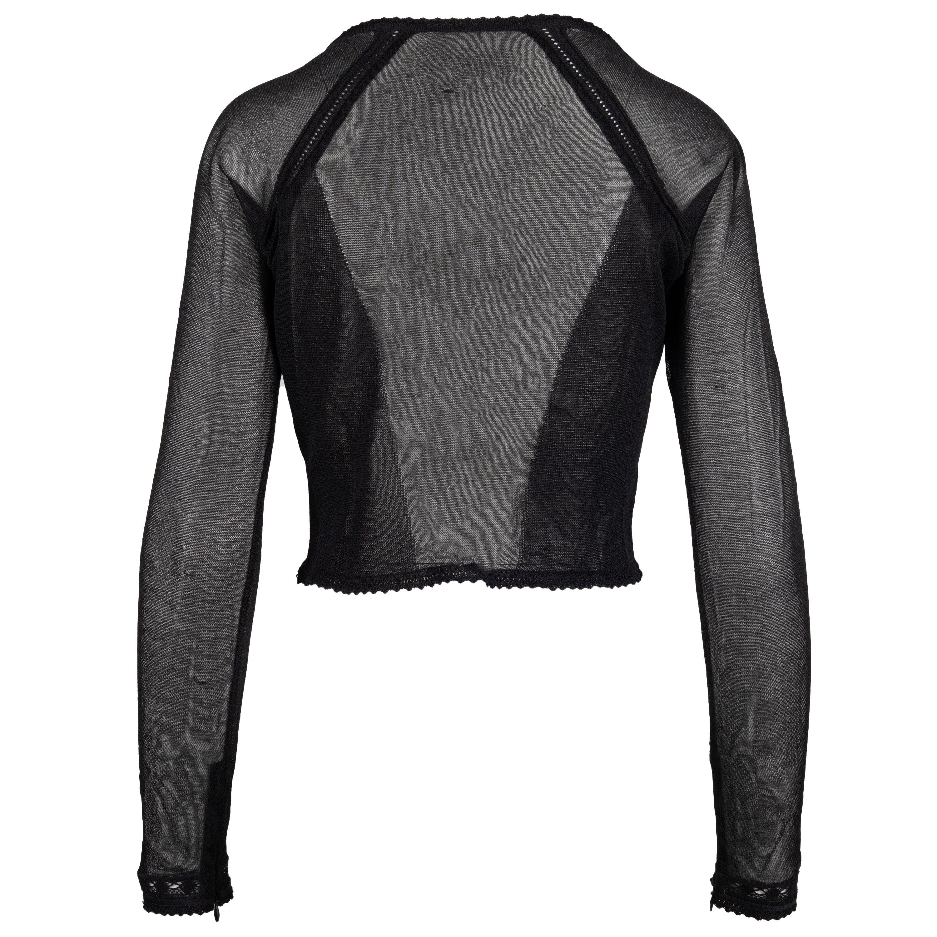 Questo top a corsetto è caratterizzato da maniche lunghe, polsini ricamati in pizzo e un corsetto con stringhe in pelle e finiture in metallo per un mix equilibrato di moda e funzionalità. Vestilo con le gonne o con i jeans per avere la massima