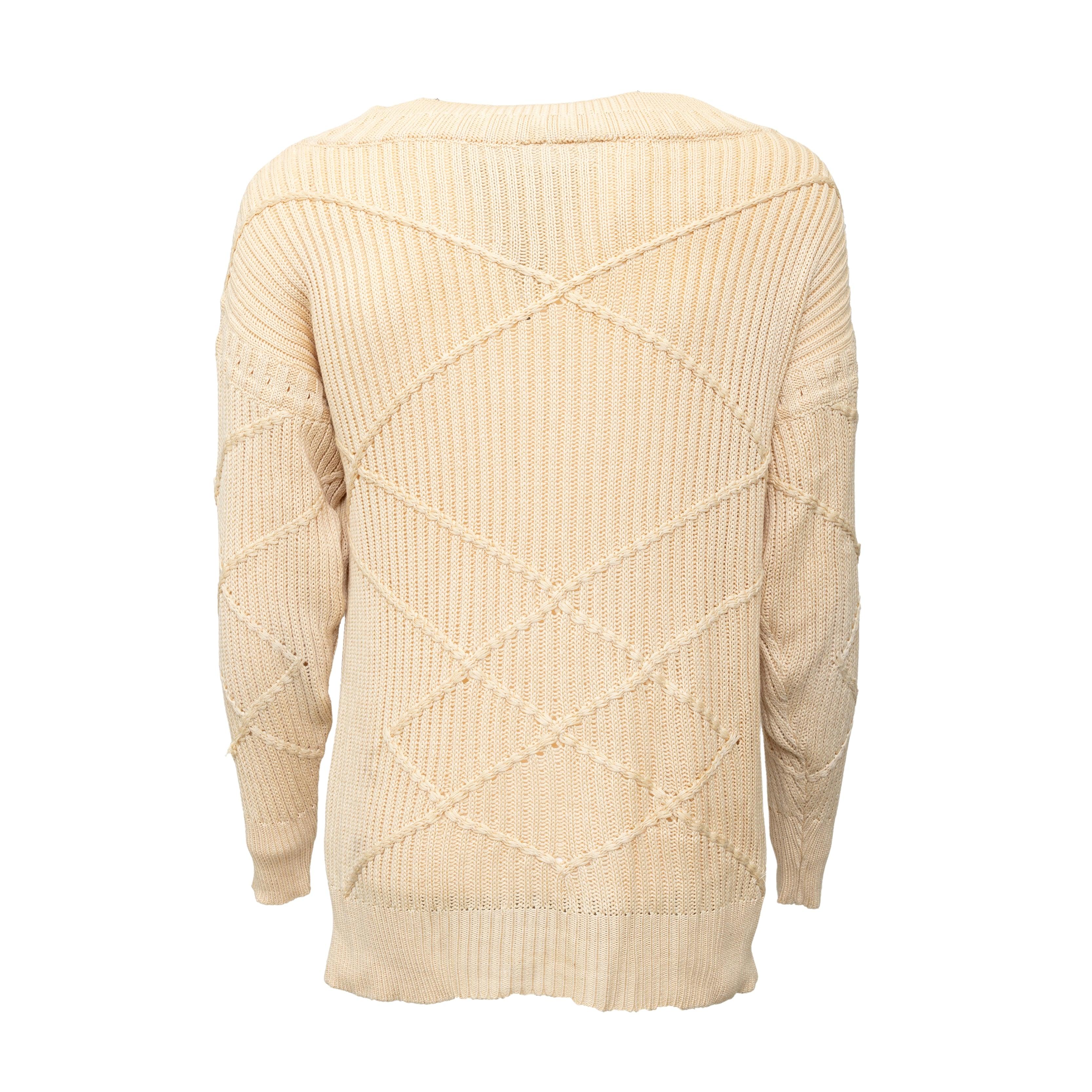 Crafted with 100% silk, this vintage sweater is the epitome of luxury and comfort. Its soft beige color and unique cable stitch pattern add texture, while the relaxed boat neckline offers a contemporary and chic look. 
 Remarks: There is no size and