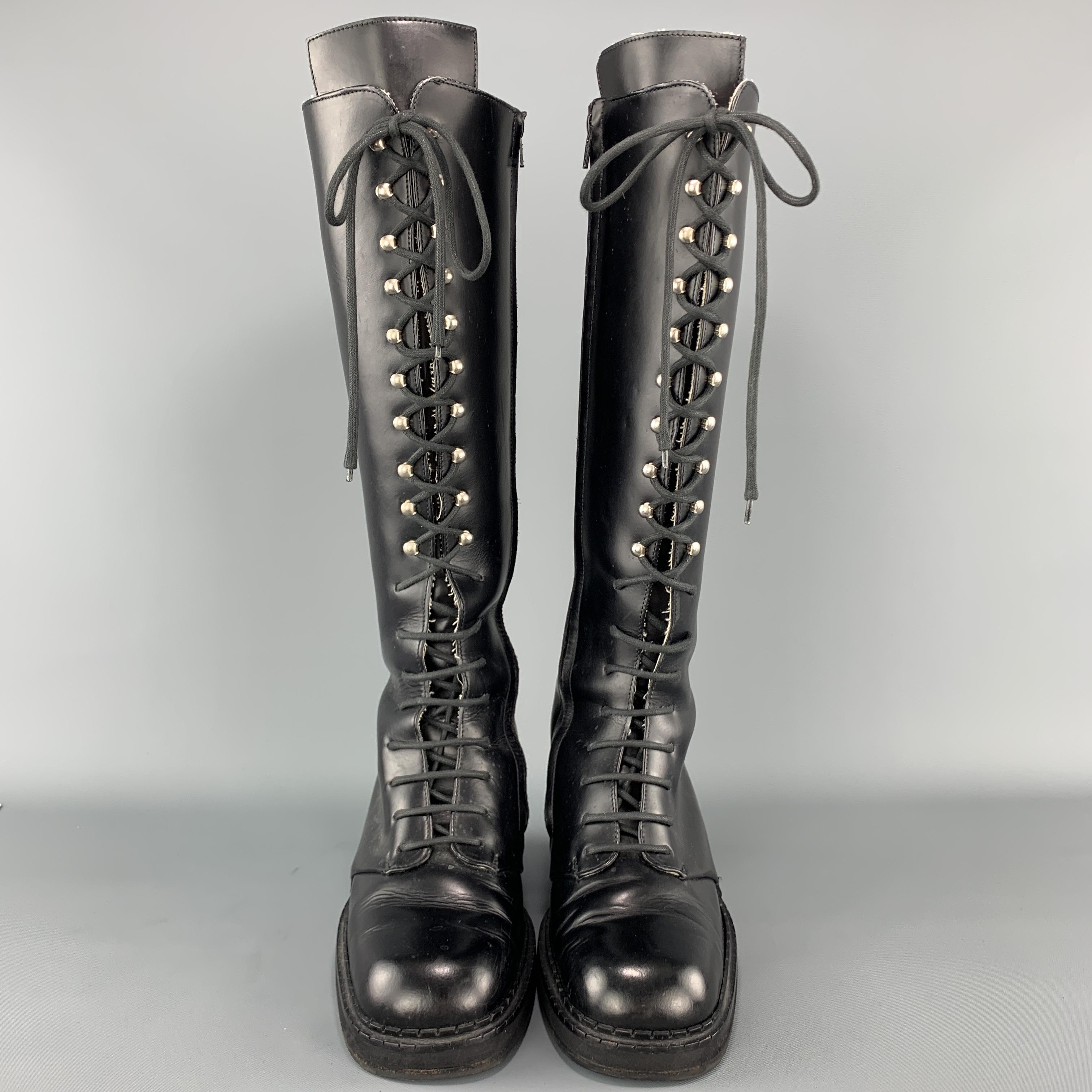 Vintage COLECTION PRIVEE? knee high boots come in smooth black leather with a hook lace up front, inner zip closure, and chunky heel. Made in Italy.

Very Good Pre-Owned Condition.
Marked: UK 7

Width: 4 in.
Heel: 2.25 in.
Length: 16.5 in.
Ankle: 10