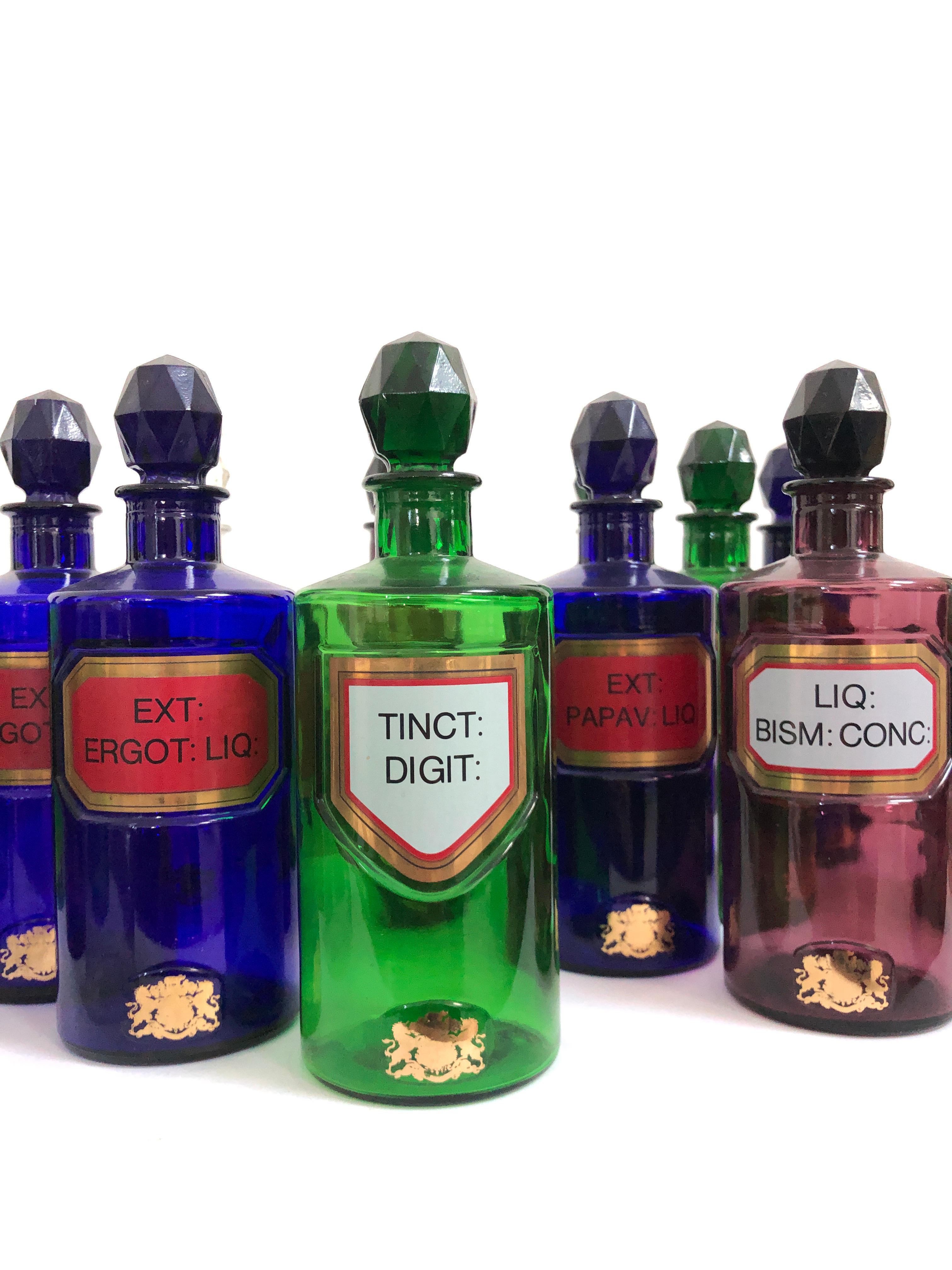 - A rare set of Royal Pharmaceutical society collectors apothecary bottles, English mid-twentieth century.
- There are 5 runs of 6 bottles, 30 bottles in total. Two of the runs are clear glass, one is cobalt blue, one purple and one green. 
- Each