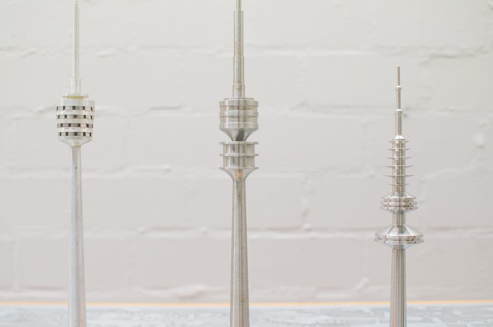 Rare and unusual collection of vintage Space Age looking TV tower models 1970 from Europe. Made of steel, brass, spun aluminum and Lucite. Stunning conversational pieces. Sizes range from 27cm to 38cm.
 