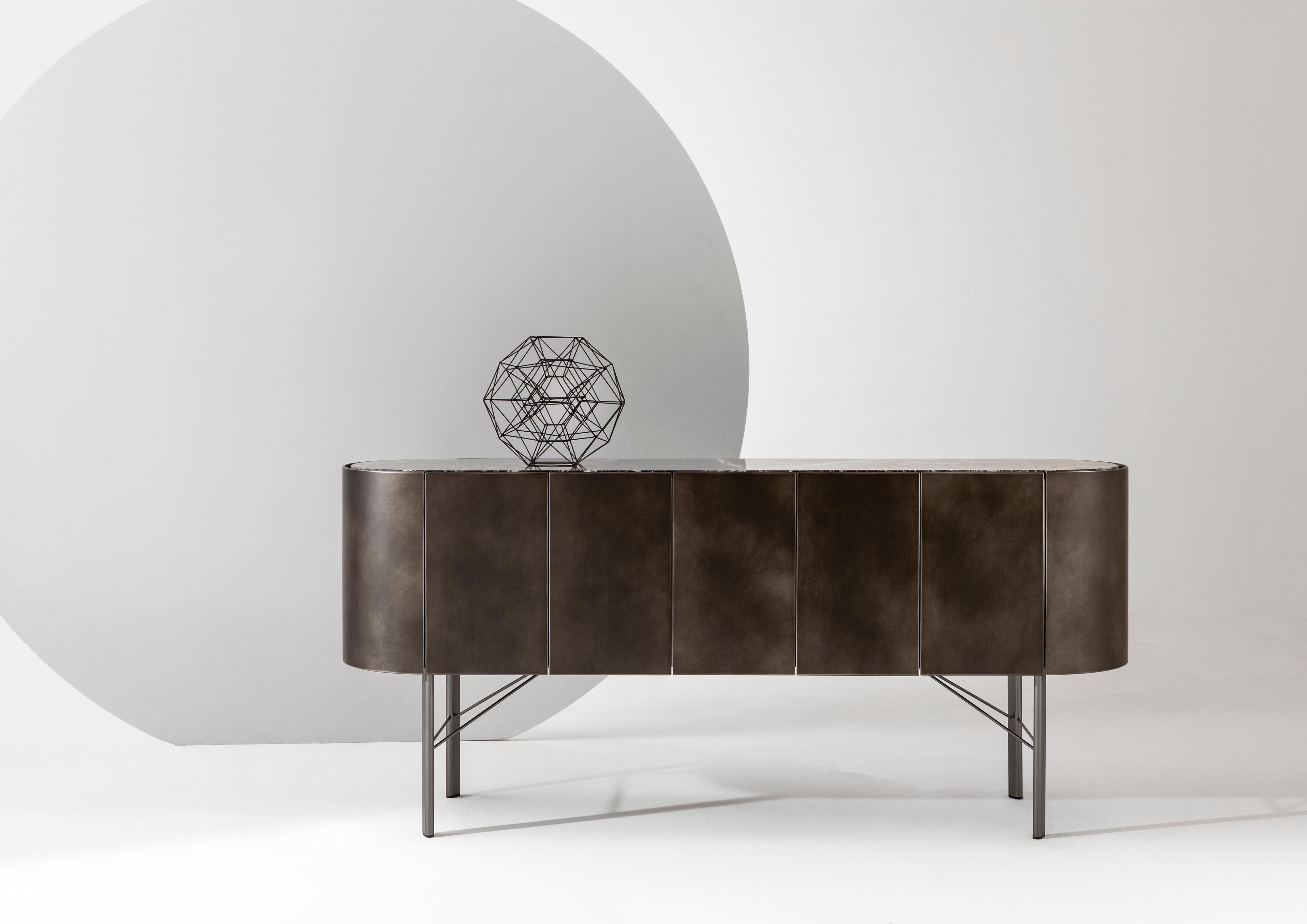 Collectionist Lounge Sideboard by Laurameroni
Dimensions: W 160 x D 40 x H 73 cm
Materials: Delabré Dark bronze; shiny Levanto marble; gunmetal legs. 

Low sideboard with curved sides, structure and doors in Delabré tin , top in shiny Levanto marble