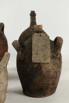 Collections of Empty Old Bottles in Terracotta