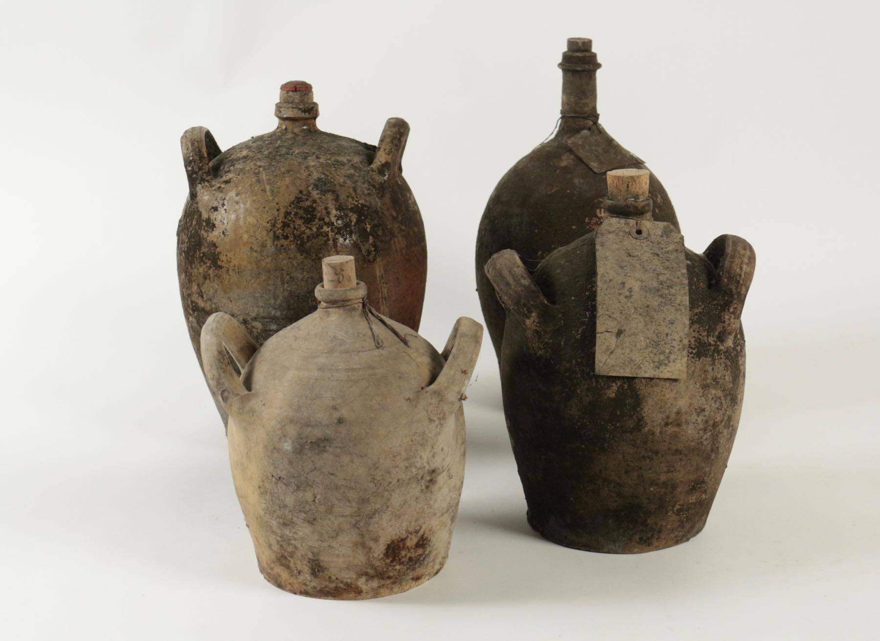 French Provincial Collections of Empty Old Bottles in Terracotta For Sale