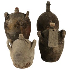 Antique Collections of Empty Old Bottles in Terracotta