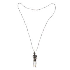 Collector Coco Chanel Doll Necklace in silver metal