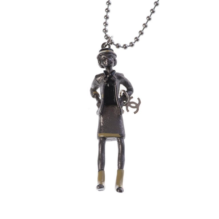 Collector Coco Chanel Doll Necklace in silver metal at 1stDibs