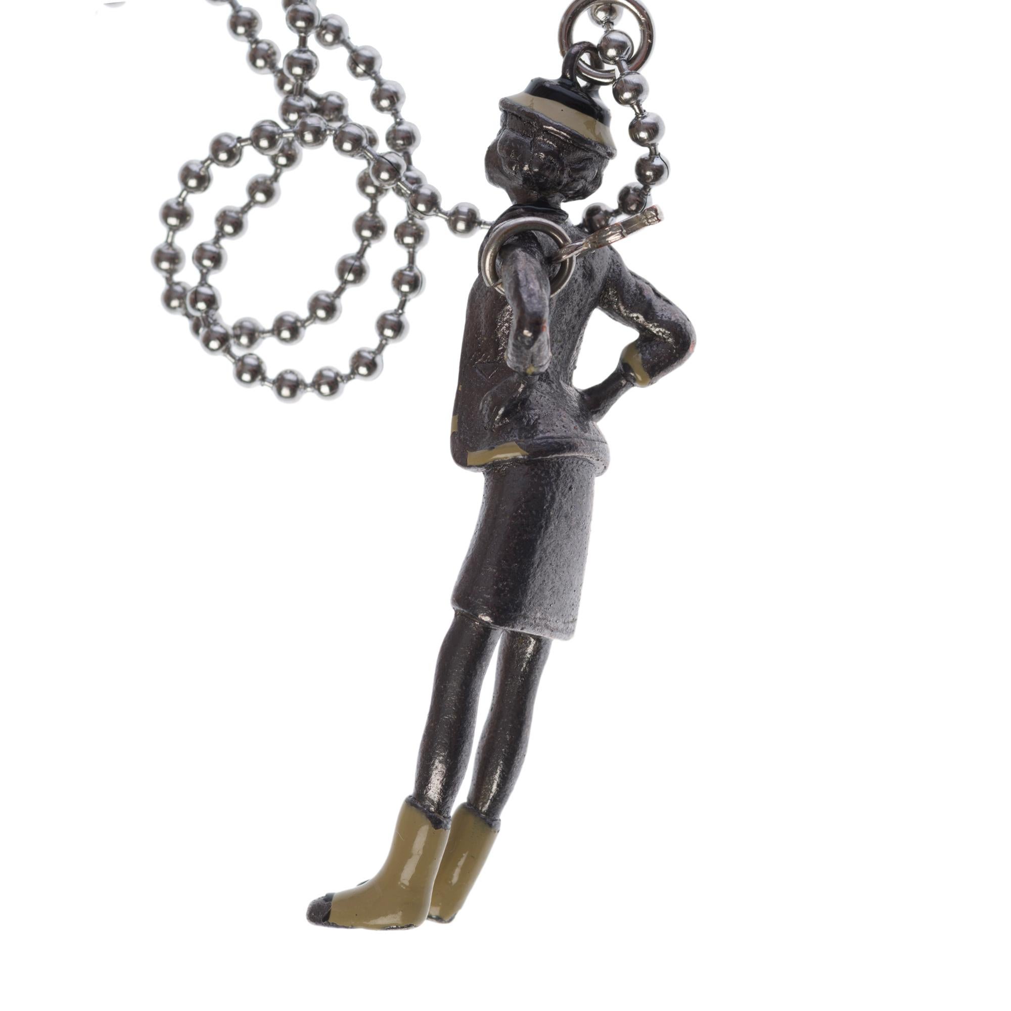 Contemporary Collector Coco Chanel Doll Necklace in silver metal