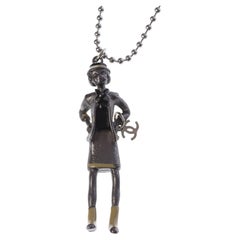 Collector Coco Chanel Doll Necklace in silver metal