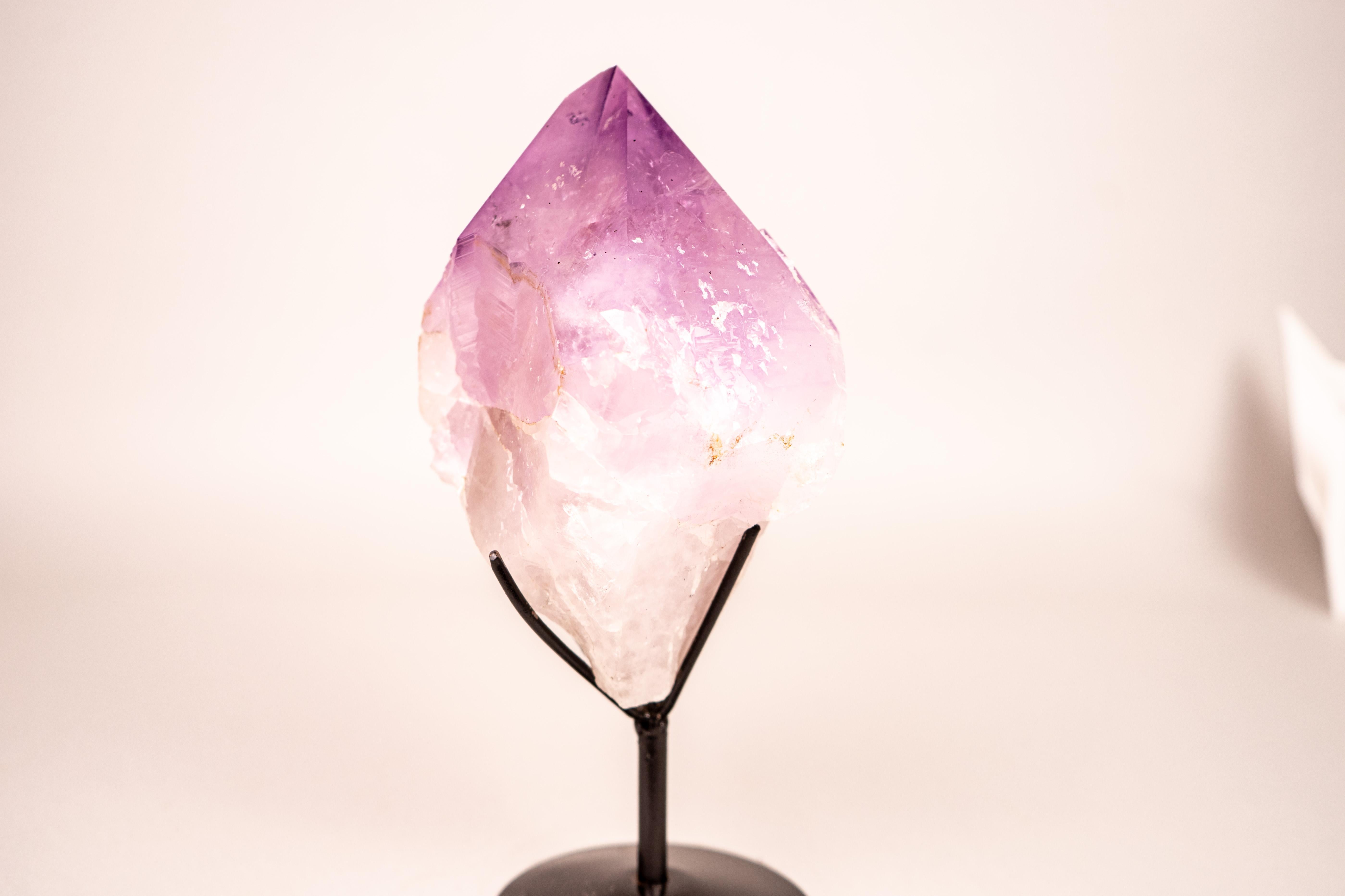 Rare XL Lavender Amethyst Point with Record Keeper Faces

▫️ Description

An Amethyst point of unparalleled size, this specimen is a showpiece of outstanding beauty. The crystal displays a soft yet vivid shade of lavender that shifts gently with the