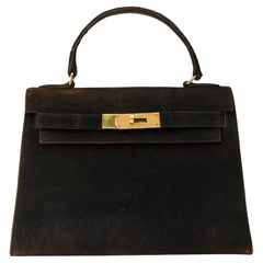 Collector Hermès Kelly 25 Doblis in black suede and gold hardware