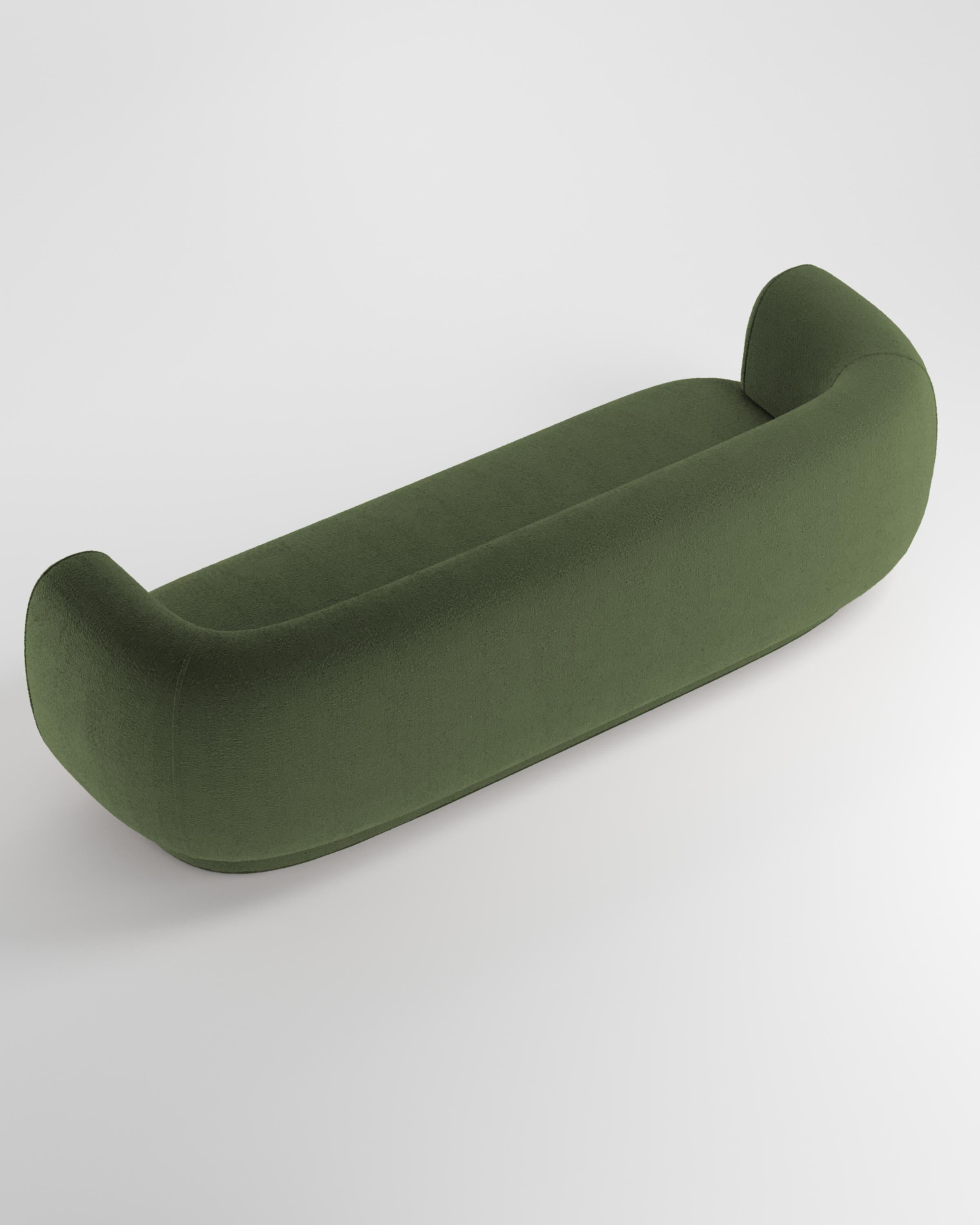 Hug sofa is defined by clean, simple lines and a distinctive armrest detail.
The armrest, half overlapping the seat cushion, creates an interlocking detail between the two elements, while the padding, firm and welcoming at the same time,