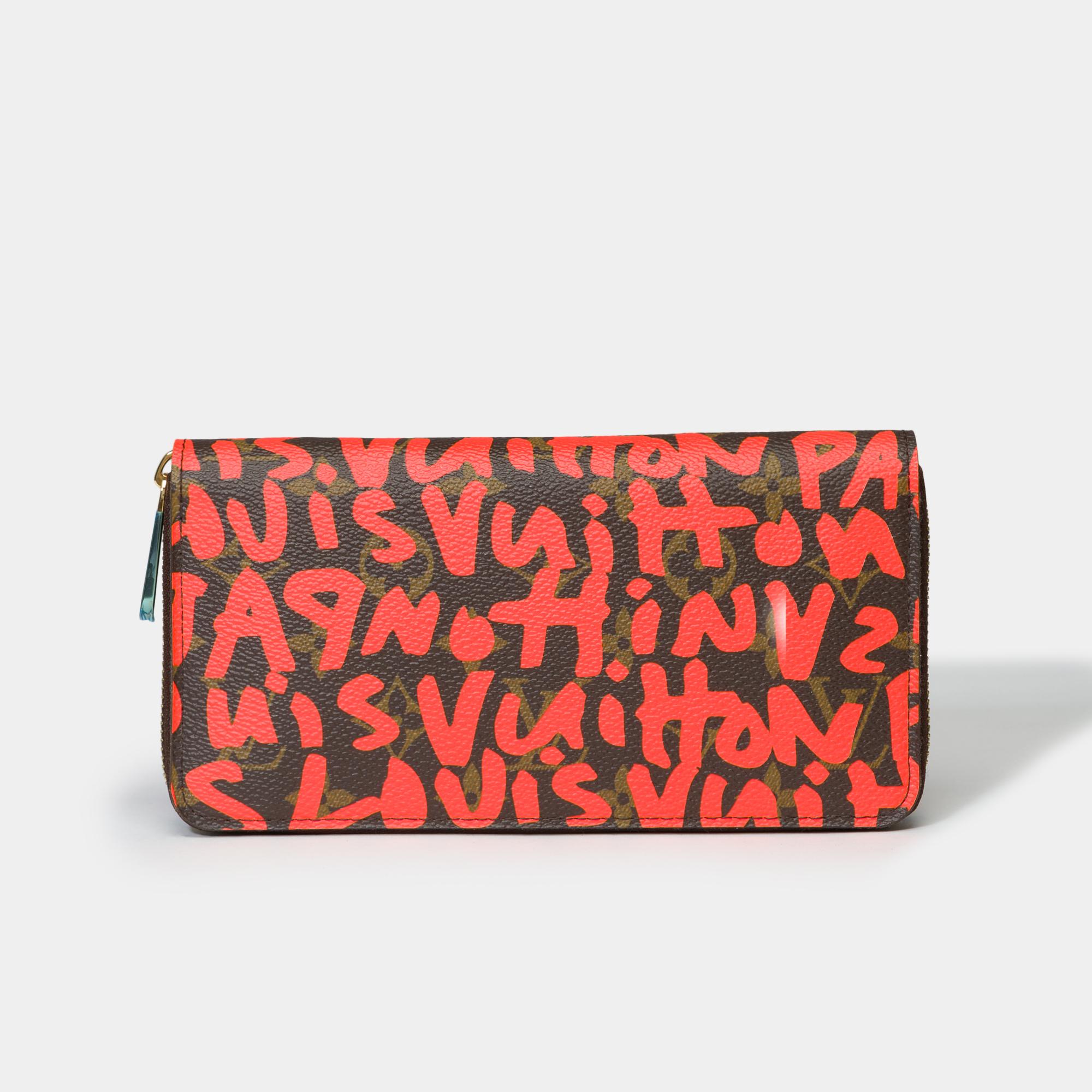 Amazing​ ​Collector’s​ ​Wallet​ ​and​ ​highly​ ​sought​ ​after​ ​Louis​ ​Vuitton​ ​Zippy​ ​Graffiti​ ​limited​ ​edition​ ​from​ ​by​ ​Stephen​ ​Sprouse​ ​in​ ​monogram​ ​canvas​ ​coated​ ​with​ ​orange​ ​graffiti​ ​patterns,​ ​gold​ ​metal​ ​trim​