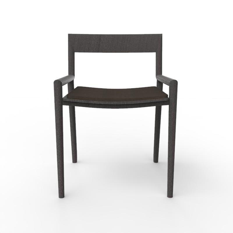 Collector Nihon Dining Chair in Black Famiglia 53 Fabric and Black Oak by Francesco Zonca

The Nihon Chair, unassuming yet essential, occupies a space with quiet dignity. Crafted from sturdy wood, its design is clean and modest, embodying