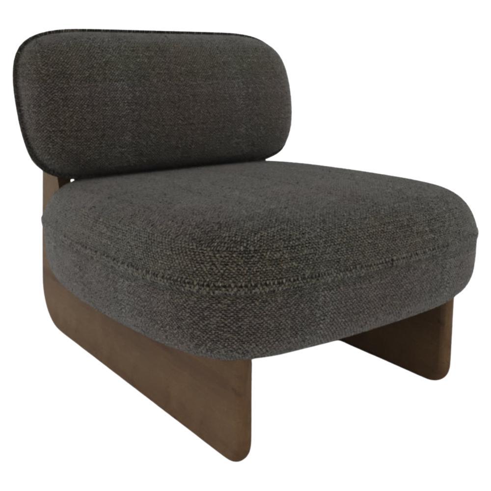 A harmonious blend of craftsmanship and relaxation, the Riva Lounge Chair features a sculptural wooden base paired with plush, upholstered cushions. Its fluid, organic form offers both visual appeal and exceptional comfort, making it a perfect
