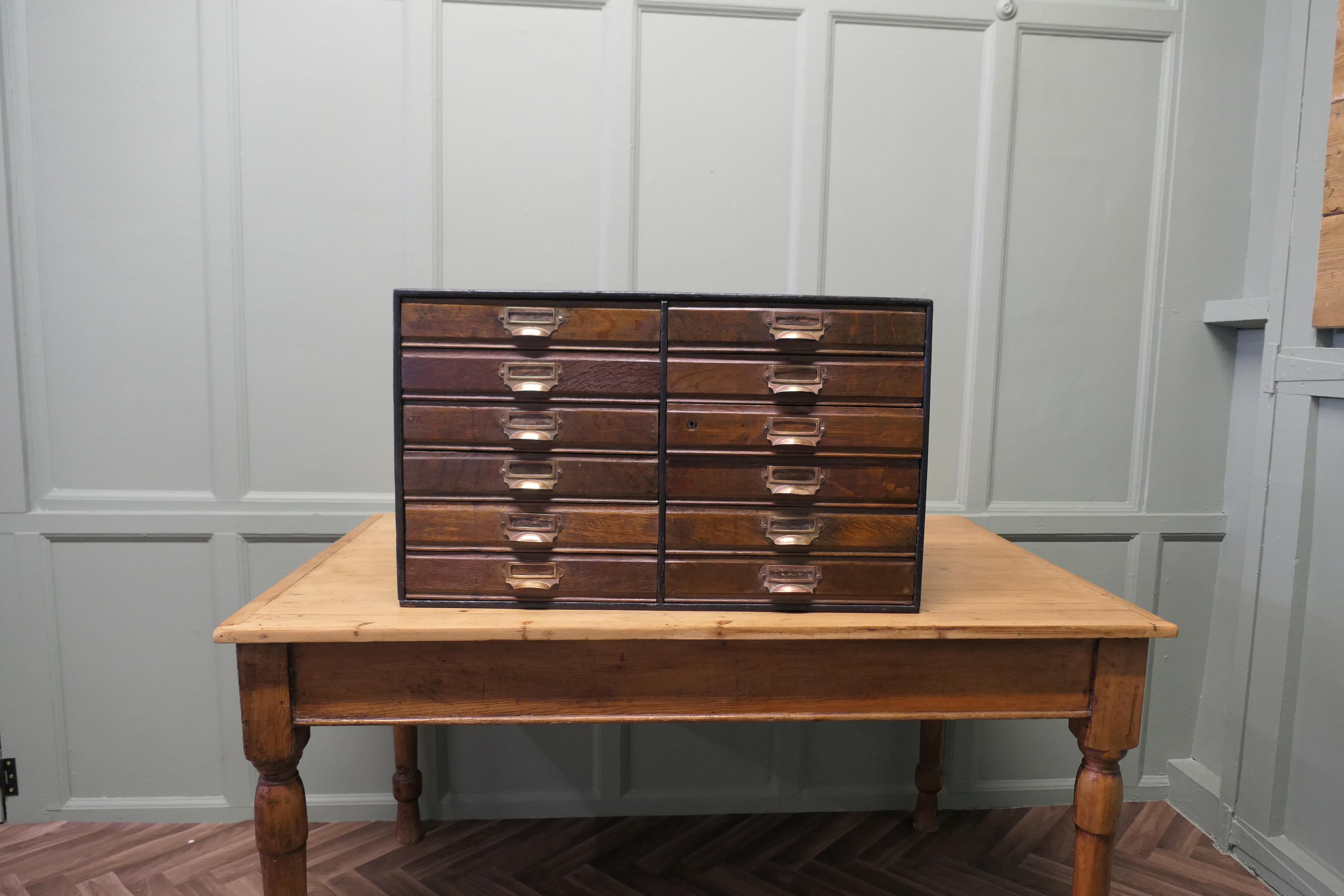 Collectors Cabinet Filing Drawers

The Cabinet has 12 Drawers each with a brass label and cup handle 
This is a very versatile cabinet and would work well for the collector or as a filing cabinet, it takes A4 sheets
The Cabinet is 18” high, 11” deep