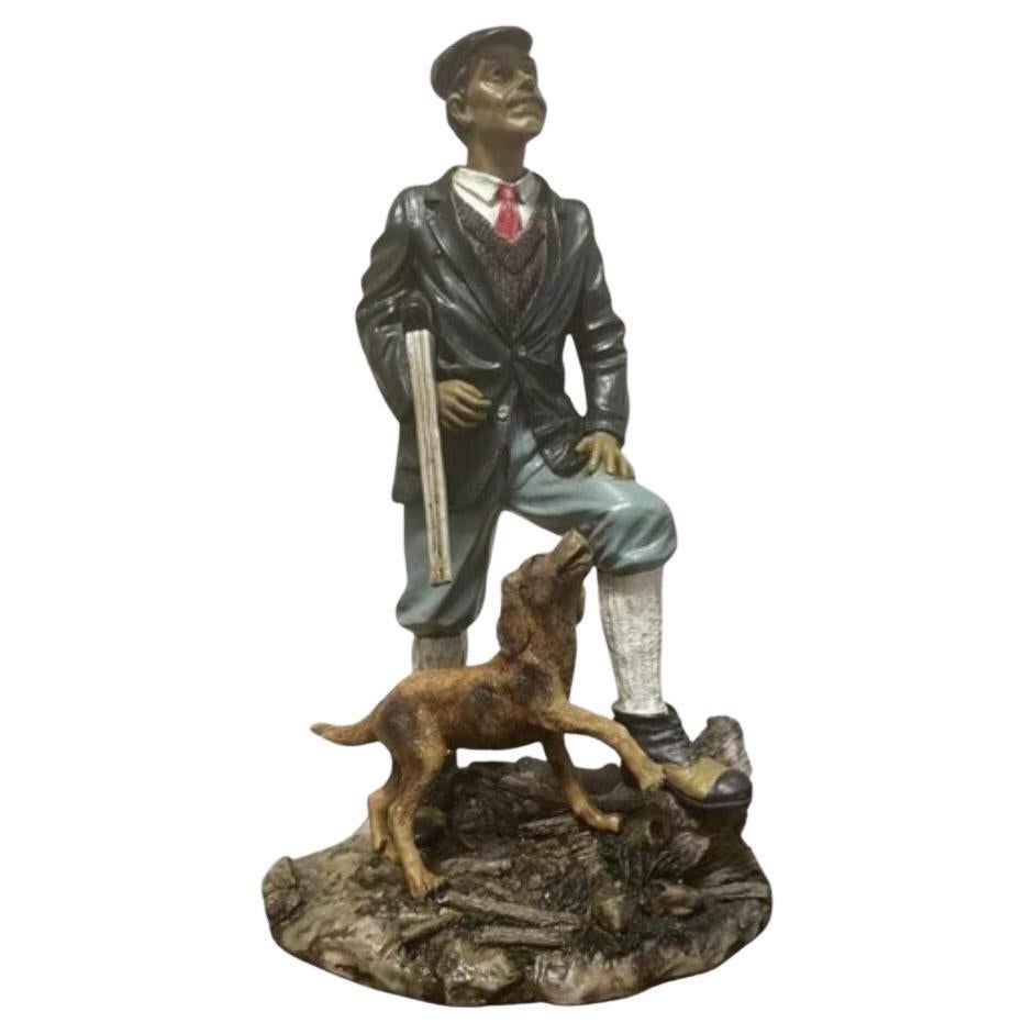 Figurina da collezione di un uomo di campagna con cane