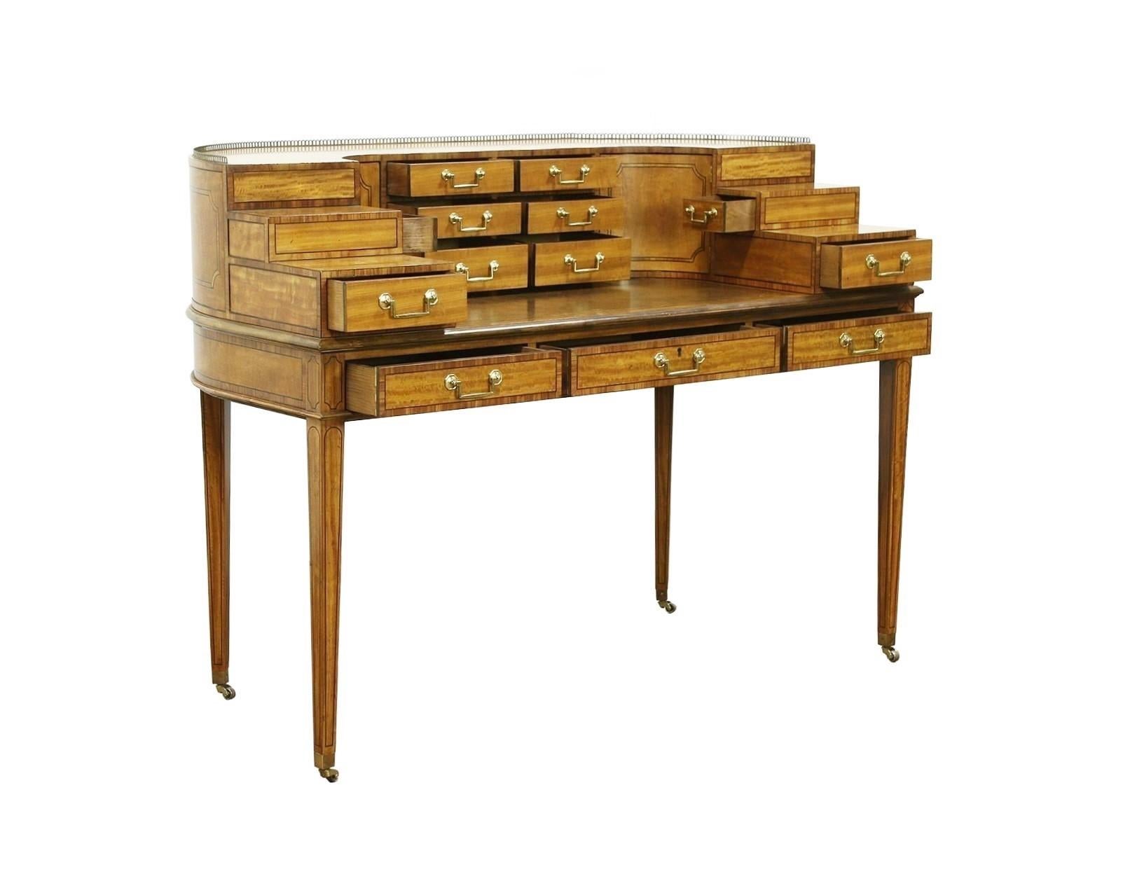 This magnificent 1765 Carlton Desk from the Collector's Edition by Baker Furniture draws inspiration from classic 18th century European designs. Demi-lune form desk crafted in rare East Indian satinwood with a stepped superstructure having an