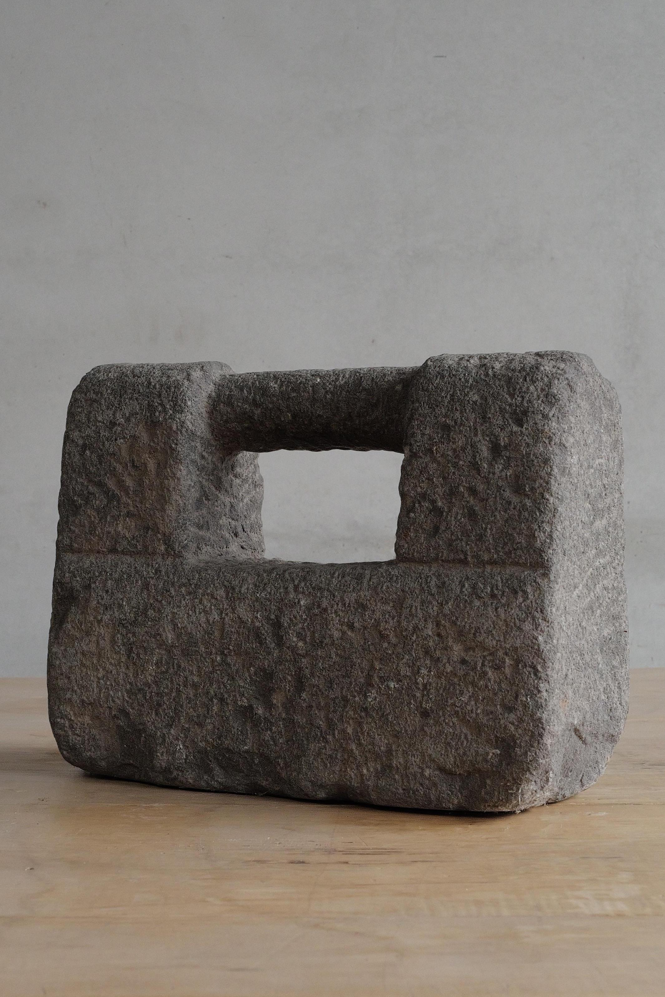 A sculptural artifact with commanding presence, this 19th-century Chinese martial arts stone weight embodies strength, discipline, and timeless craftsmanship. Originally used for physical training in traditional martial arts, these weights were