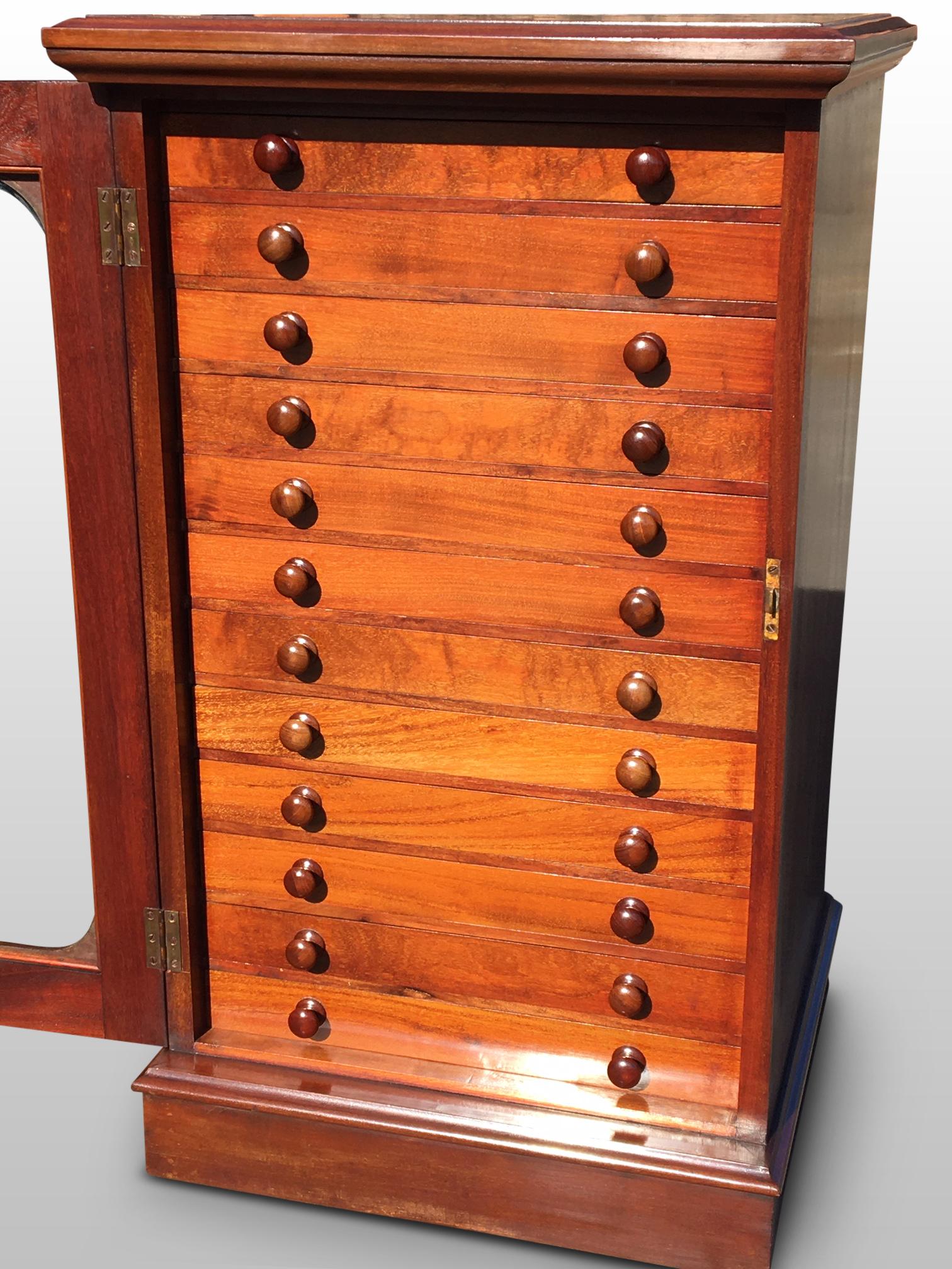Fine quality English mahogany collectors cabinet, circa 1880
This delightful cabinet has an arrangement of 12 drawers with original glass covers and
small mahogany button handles. The drawers are exceptional quality and run smoothly.
The entire