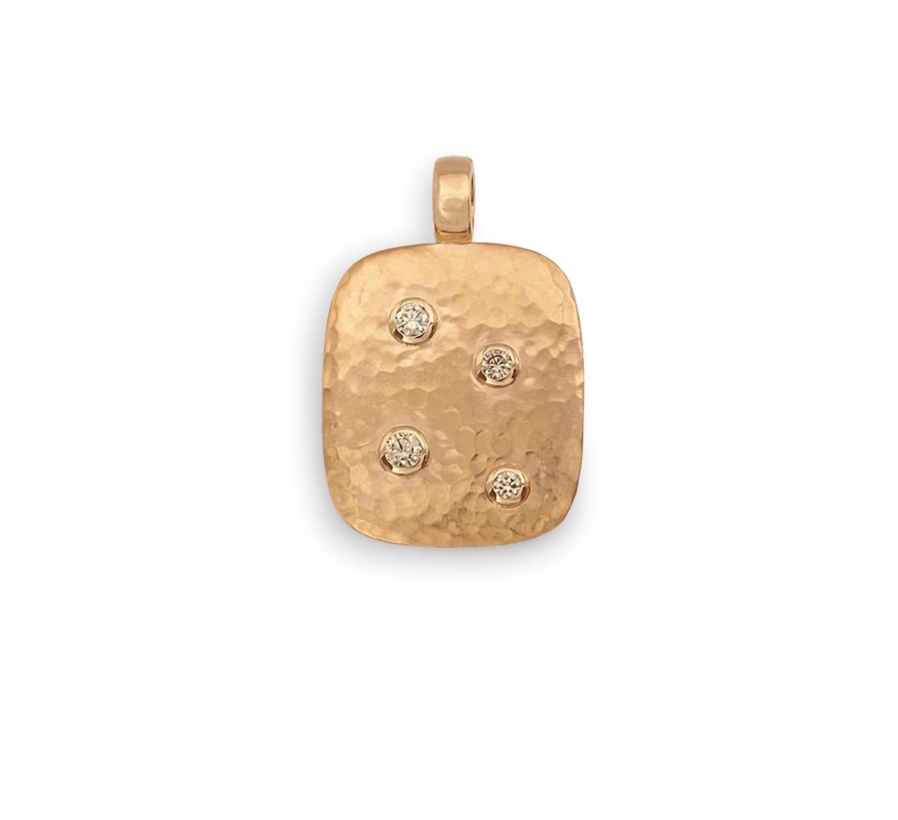 This pendant is hand hammered in 18 carat rose gold and set with 0,40 ct diamonds. It is designed by Colleen B. Rosenblat.