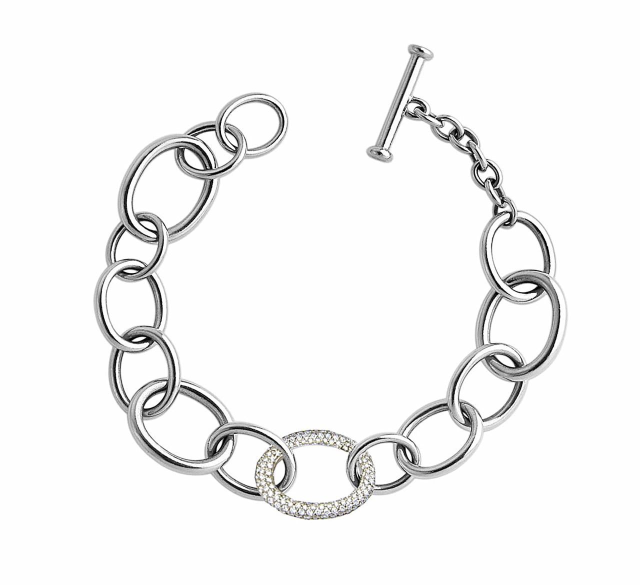 A classic 18 k white gold bracelet got an elegant twist with the one diamond loop (279 diamonds 1.42 ct TW/IF It). It is designed by Colleen B. Rosenblat. 

