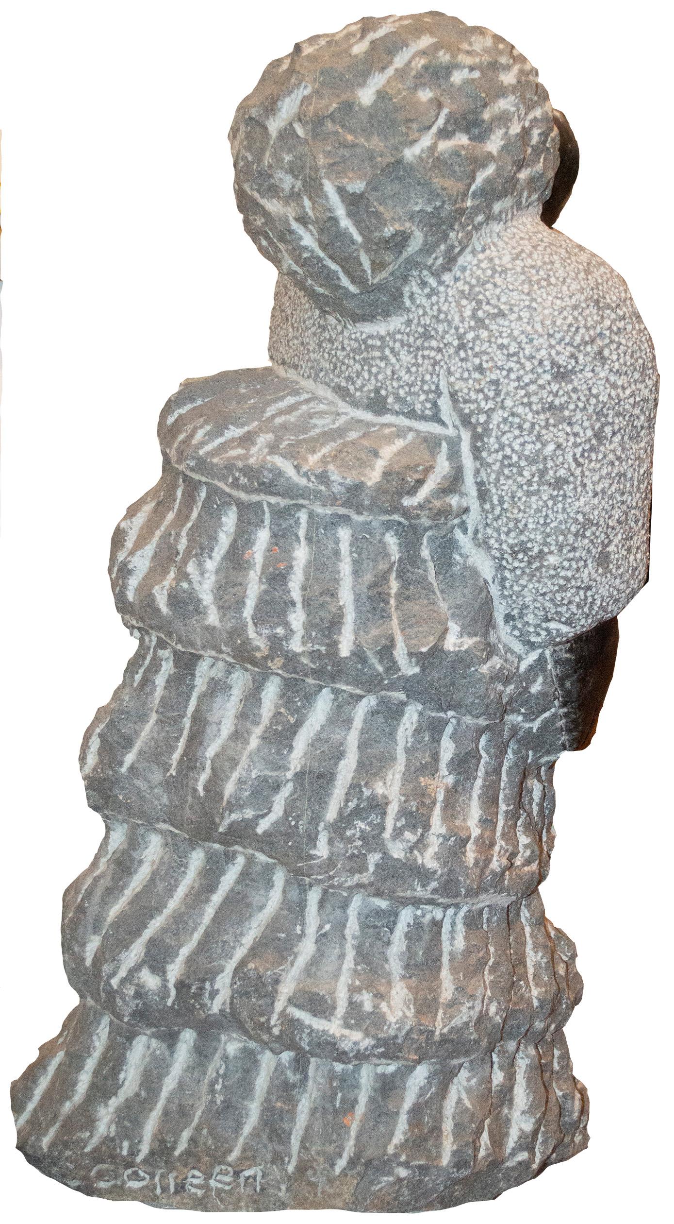 'Feeling Heart Beat' is an original black serpentine sculpture by the celebrated second generation Shona artist Colleen Madamombe. The sculpture presents a character common to Madamombe's work: a woman with a round face and wearing a billowing,