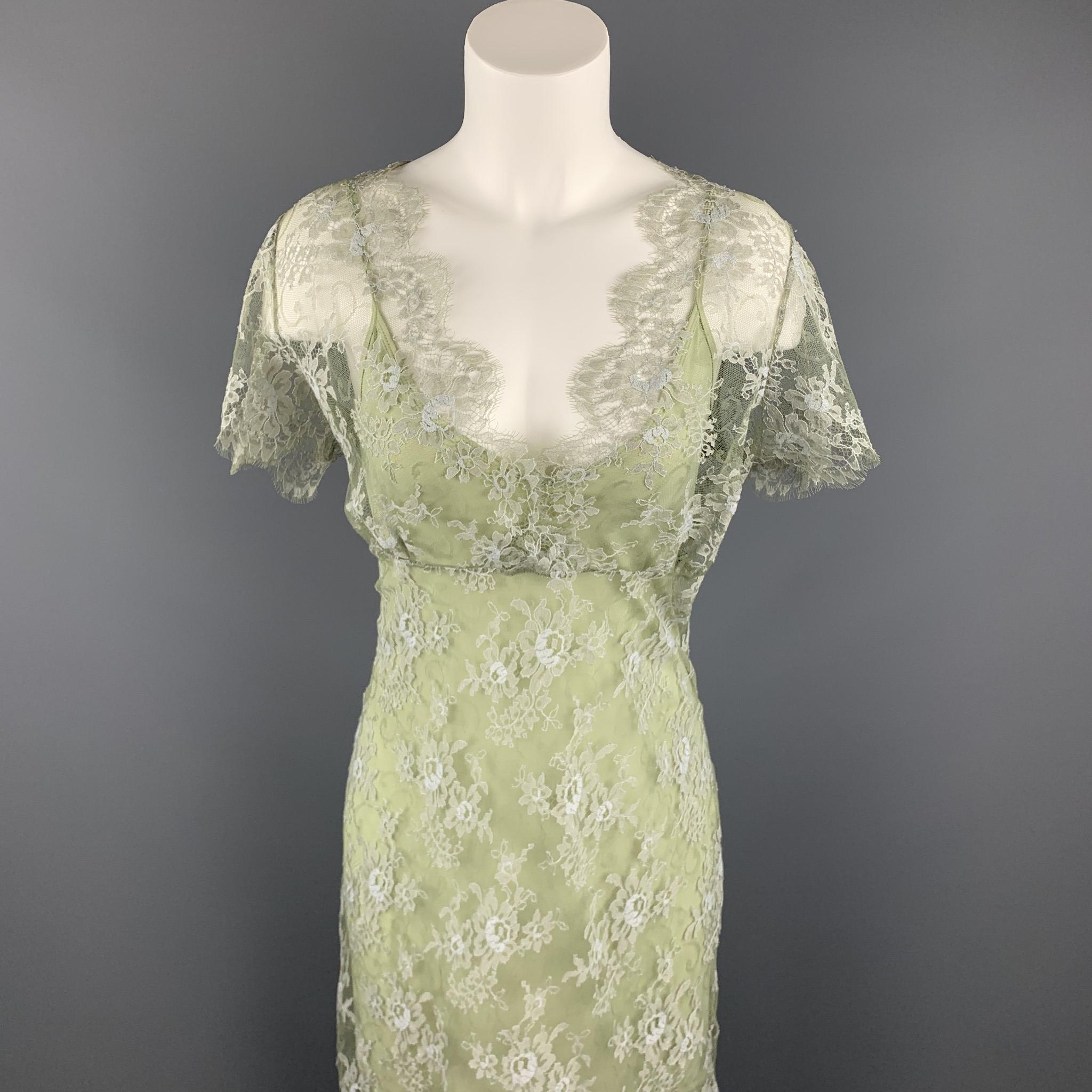 COLLETTE DINNIGAN cocktail dress comes in a green lace nylon / spandex with a lined body, a-line shift silhouette, v-neck, and short sleeves. Made in Australia.

Excellent Pre-Owned Condition.
Marked: L

Measurements:

Shoulder: 16 in. 
Bust: 38 in.