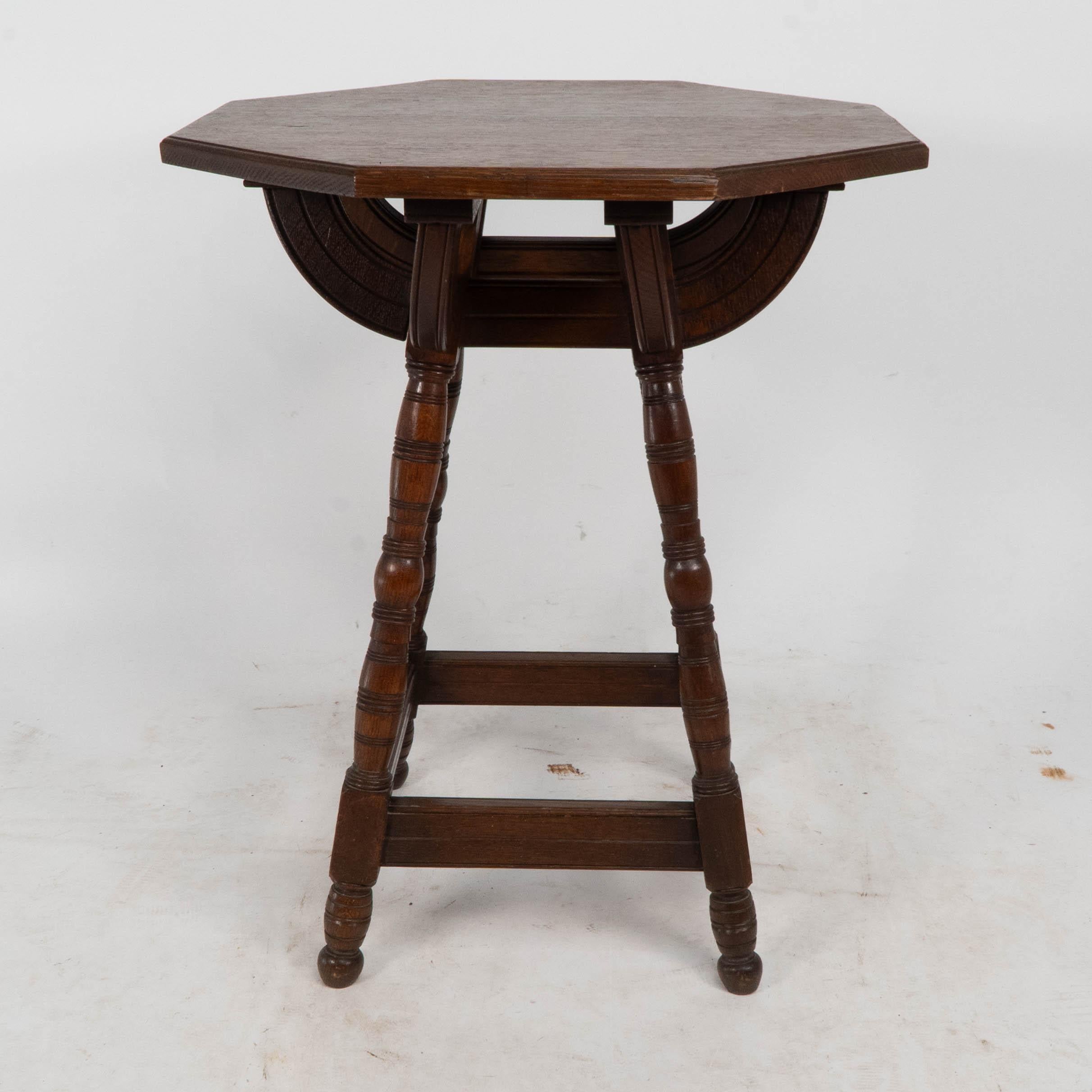 Oak Collier and Plucknett. A rare Gothic Revival oak side table For Sale