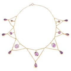 Collier draperie Belle époque en or et améthyste
