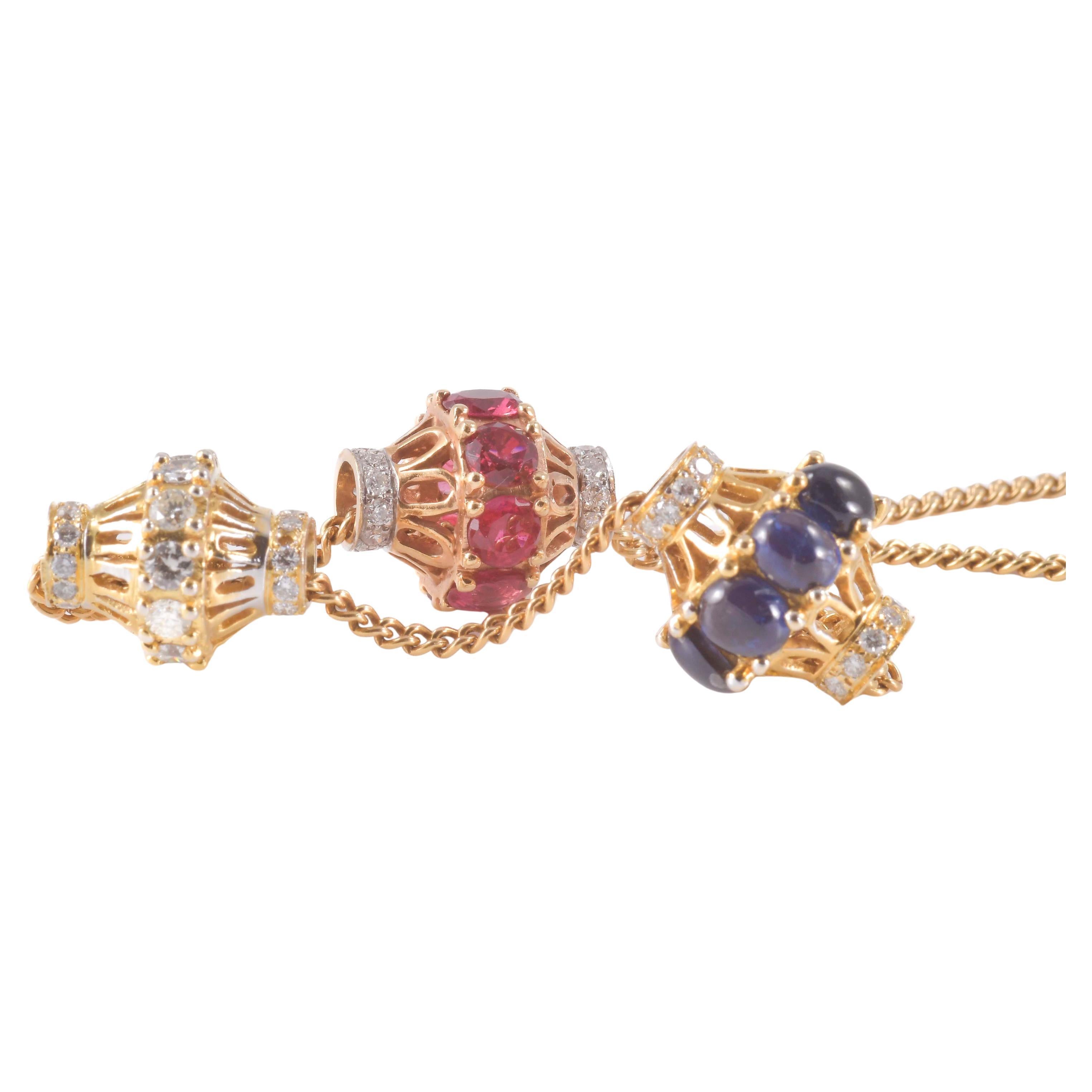 Collier in oro con tre cioncioli a cursore mobili en venta