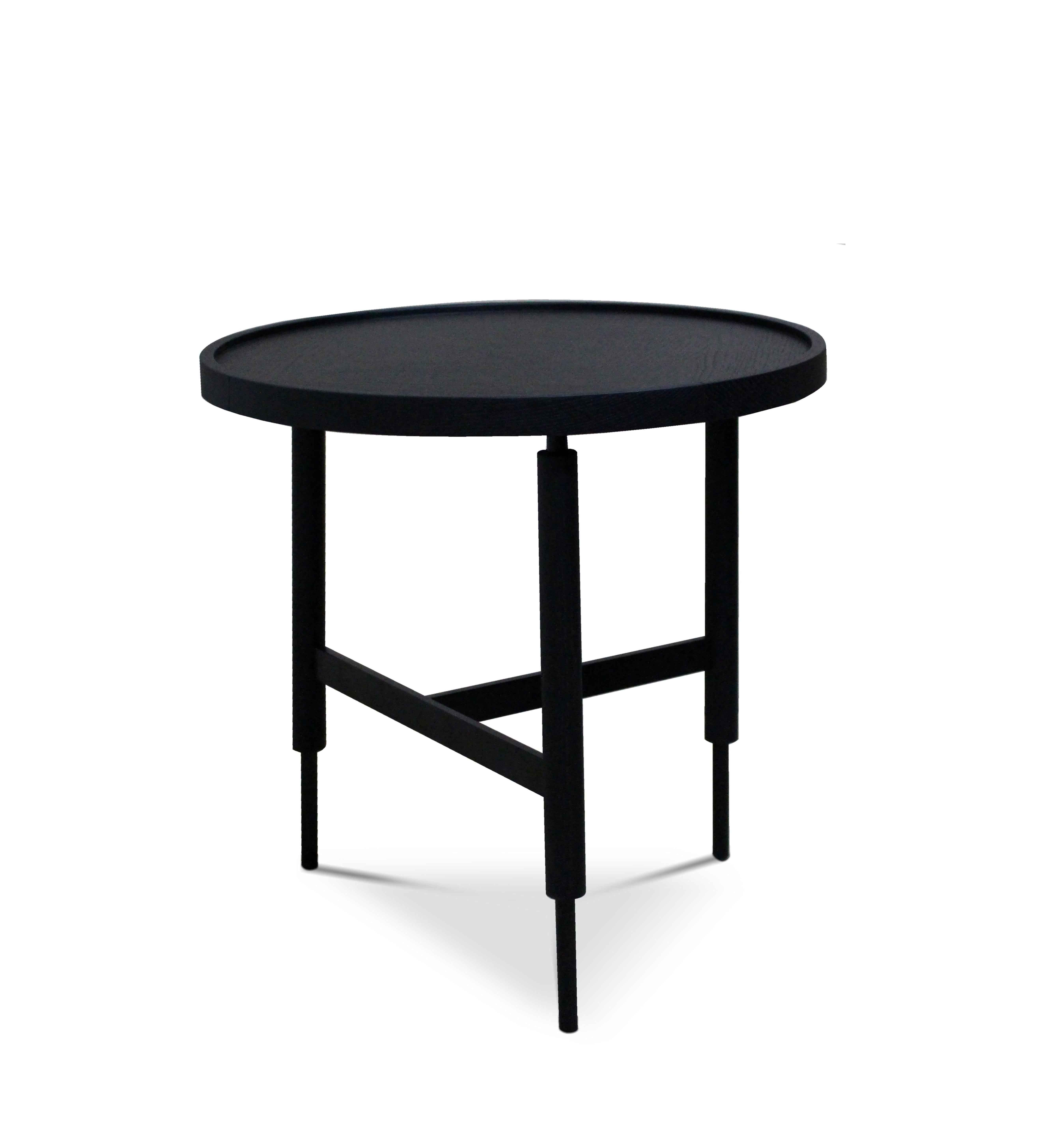 21st century designed by Collector Studio Collin side table.
The slender legs of wood and metal, the beautiful crossing details and a contrasting solid wood top, provides a large combination of materials in these side tables. They come in two