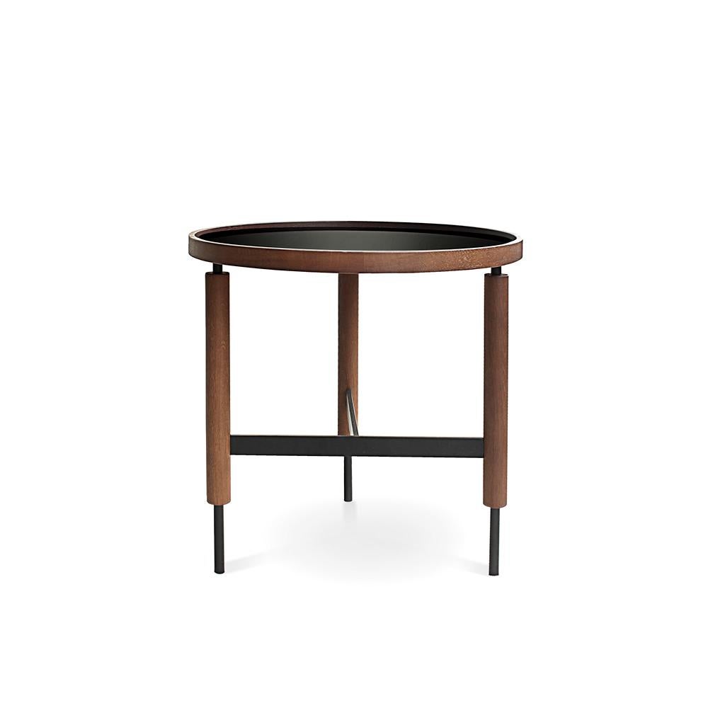 21st century designed by Collector Studio Collin side table.
The slender legs of wood and metal, the beautiful crossing details and a contrasting solid wood top, provides a large combination of materials in these side tables. They come in two