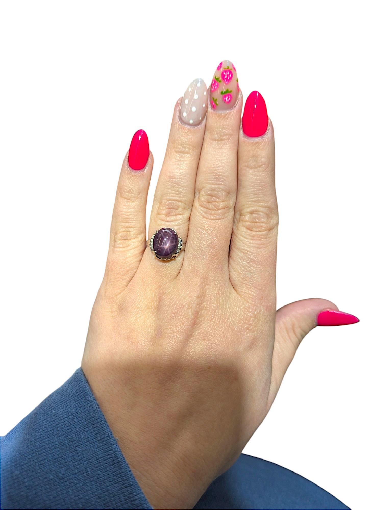 Bold. Mystical. Radiantly rare. The Collins Ring by Mountain Song Jeweler is a stunning statement piece featuring a captivating 7 carat natural Star Ruby, nestled in a sleek 18k white gold setting. Enhanced with .12 carat total weight of SI-I1