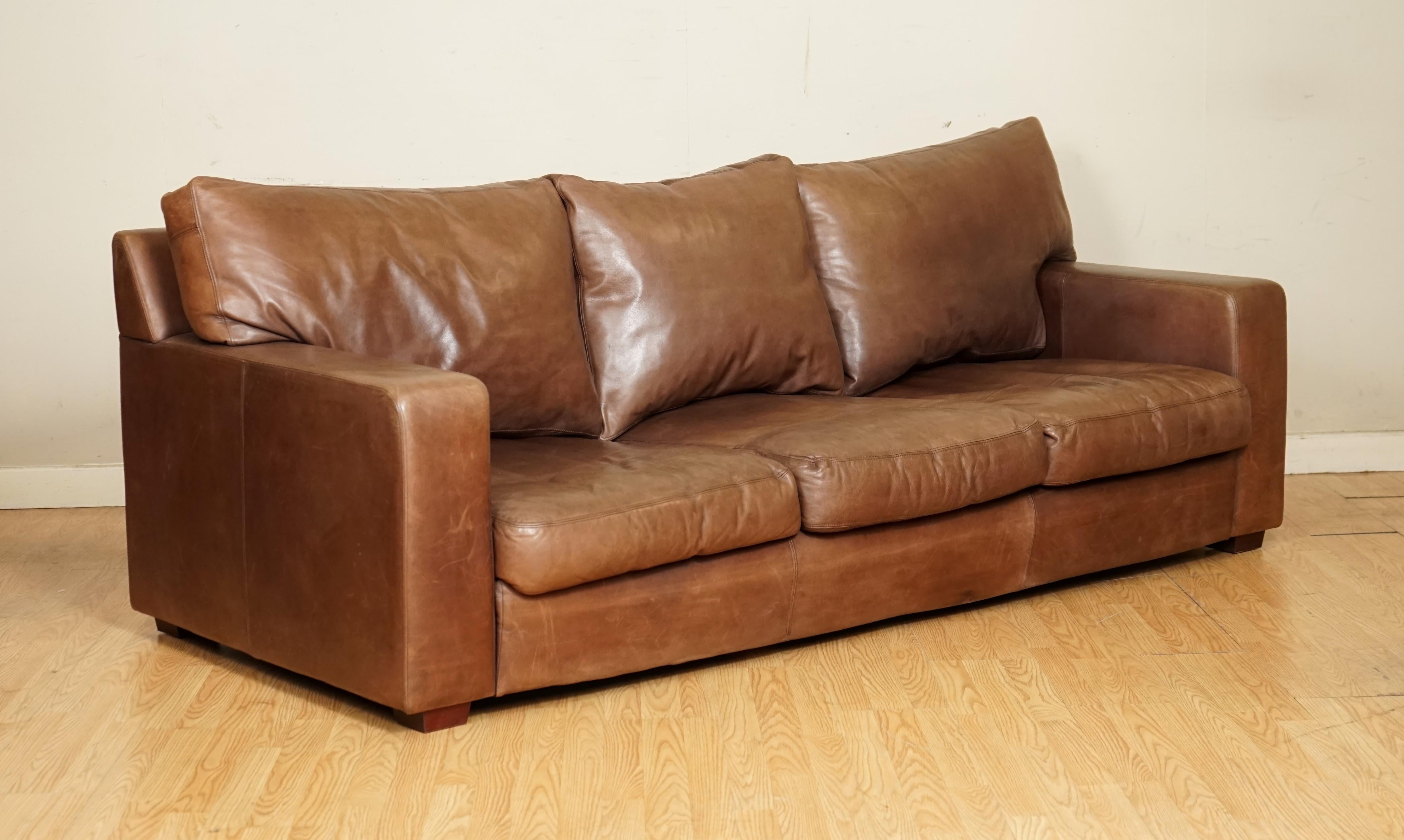 We are so excited to present to you this Beautiful Buttery Soft Leather Collins & Hayes Sofa.

This sofa is a very well made a solid piece. The arms are removable, so it can manouver better to get inside your home and the back cushions are feather