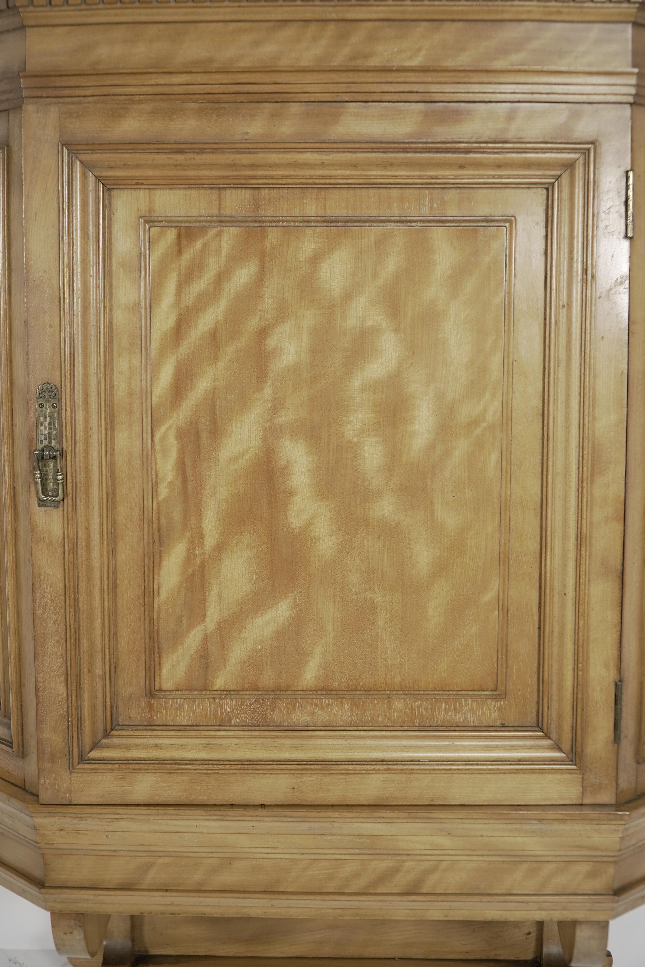 Walnut Collinson and Lock. An Aesthetic Movement Satin walnut breakfront wall cupboard For Sale