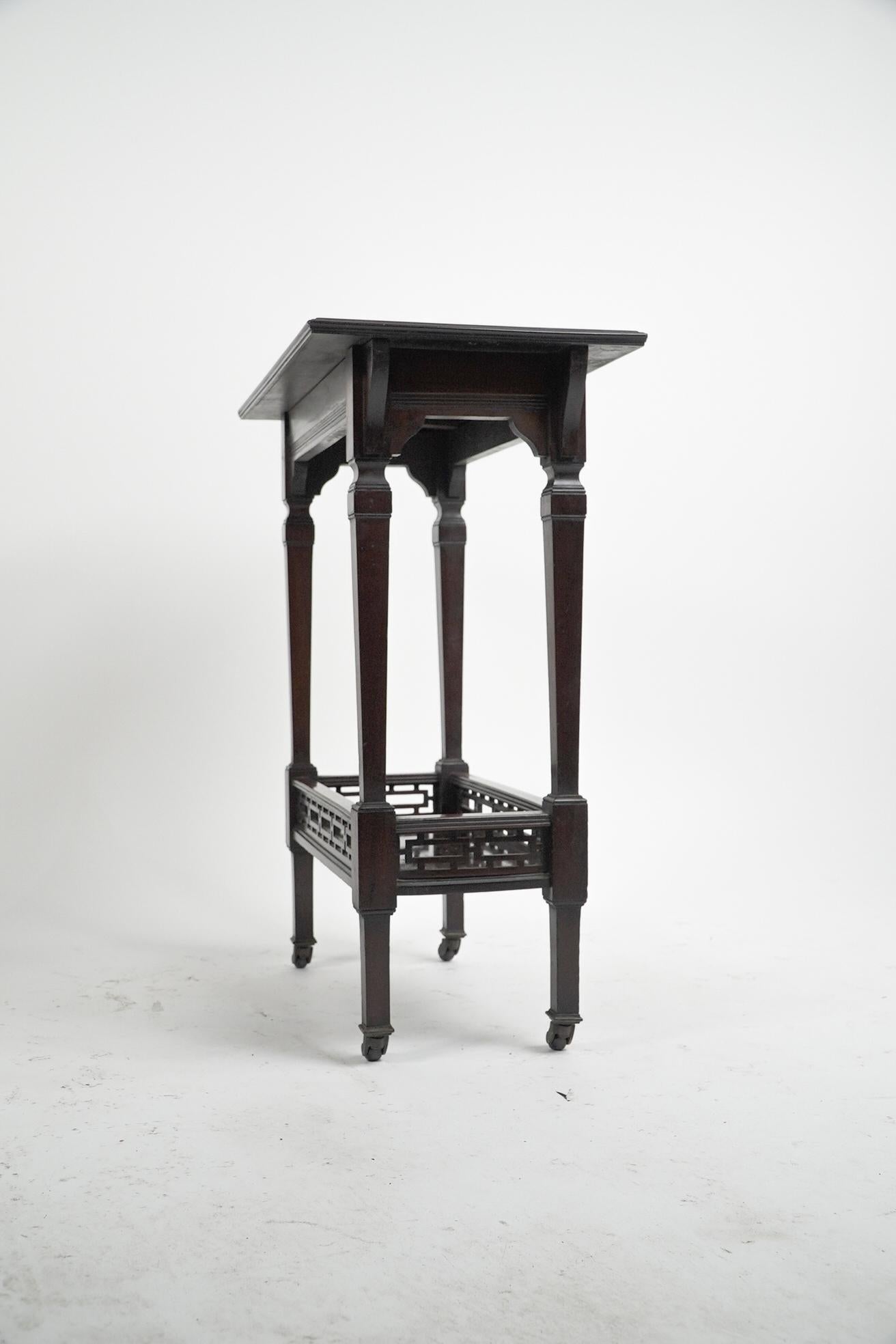 Late 19th Century Collinson & Lock (attributed). A small Aesthetic Movement mahogany side table. For Sale