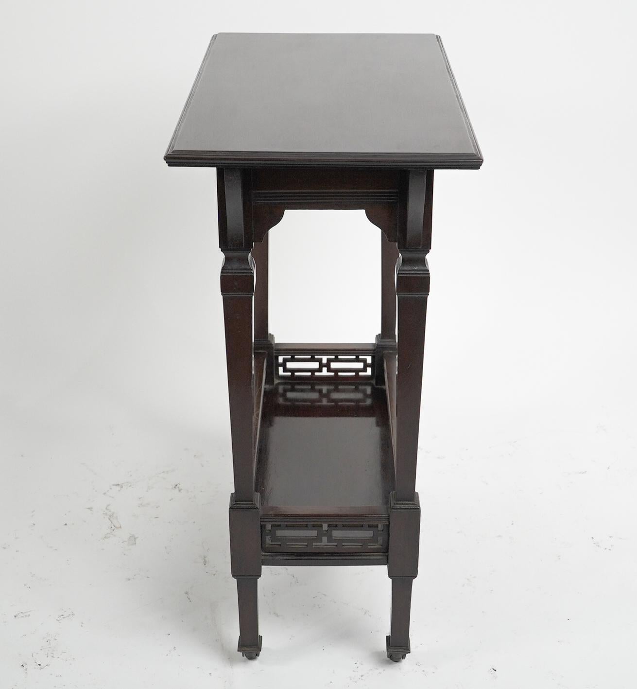 English Collinson & Lock (attributed). A small Aesthetic Movement mahogany side table. For Sale