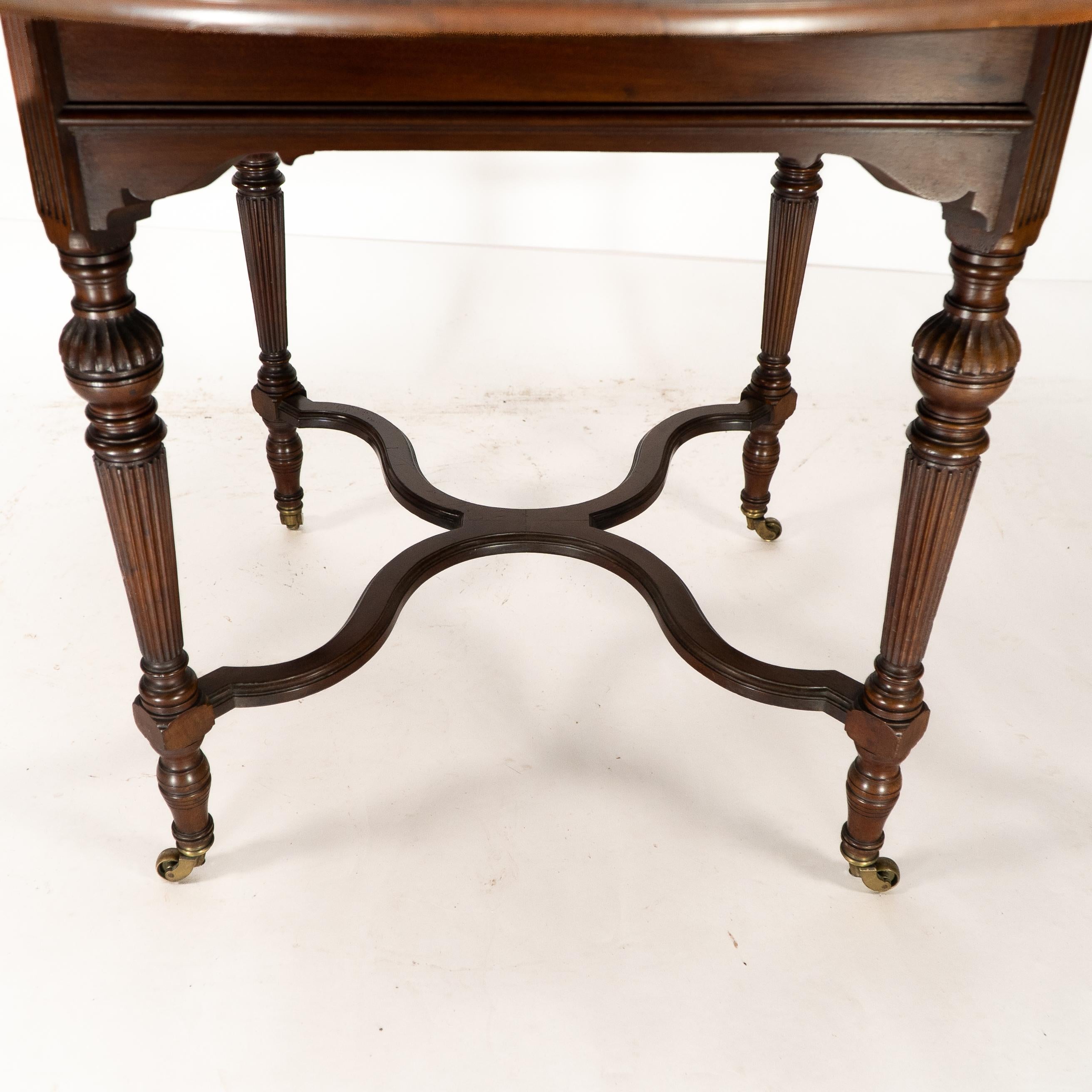 Collinson & Lock attributed. An Aesthetic Movement walnut circular center table For Sale 7