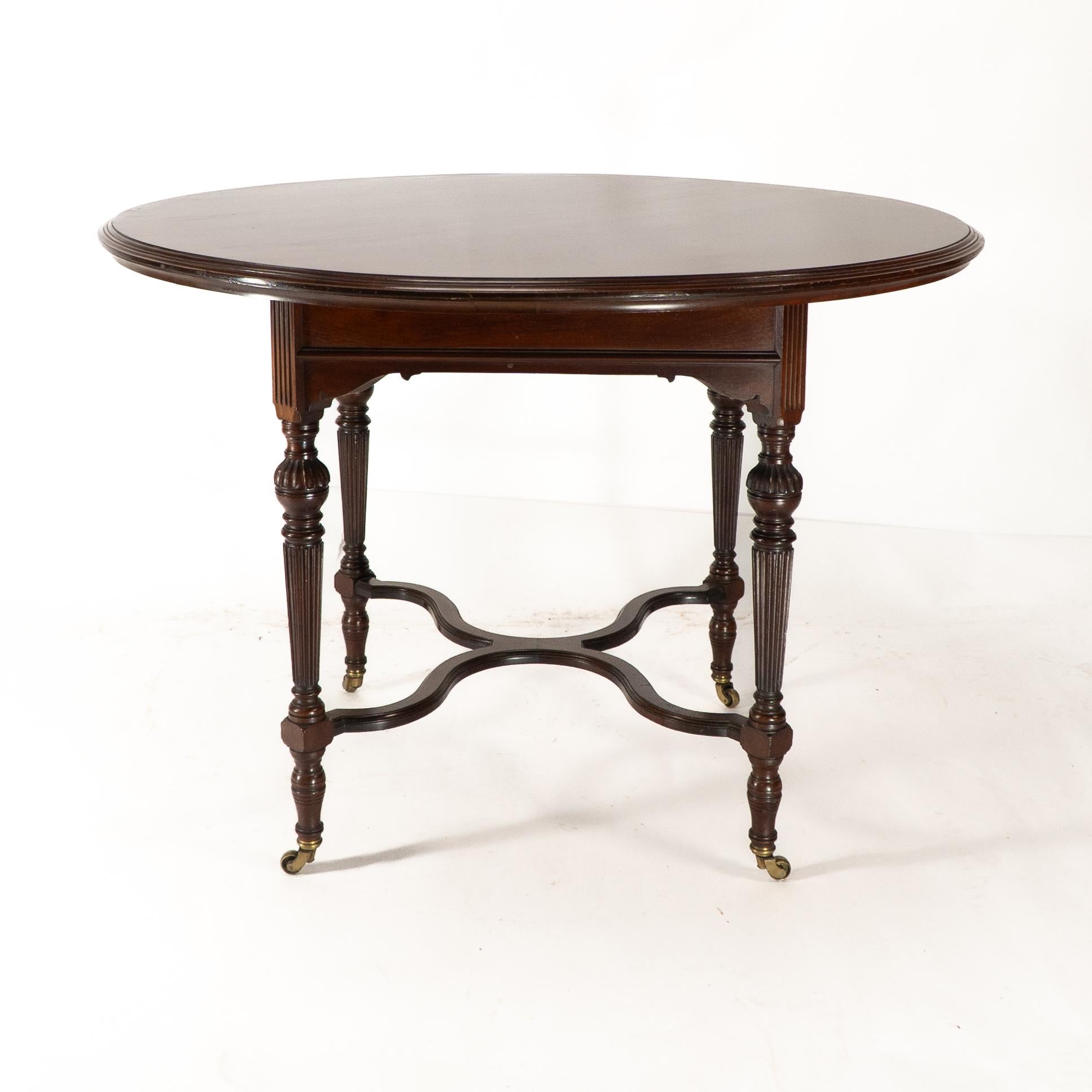 Late 19th Century Collinson & Lock attributed. An Aesthetic Movement walnut circular center table For Sale