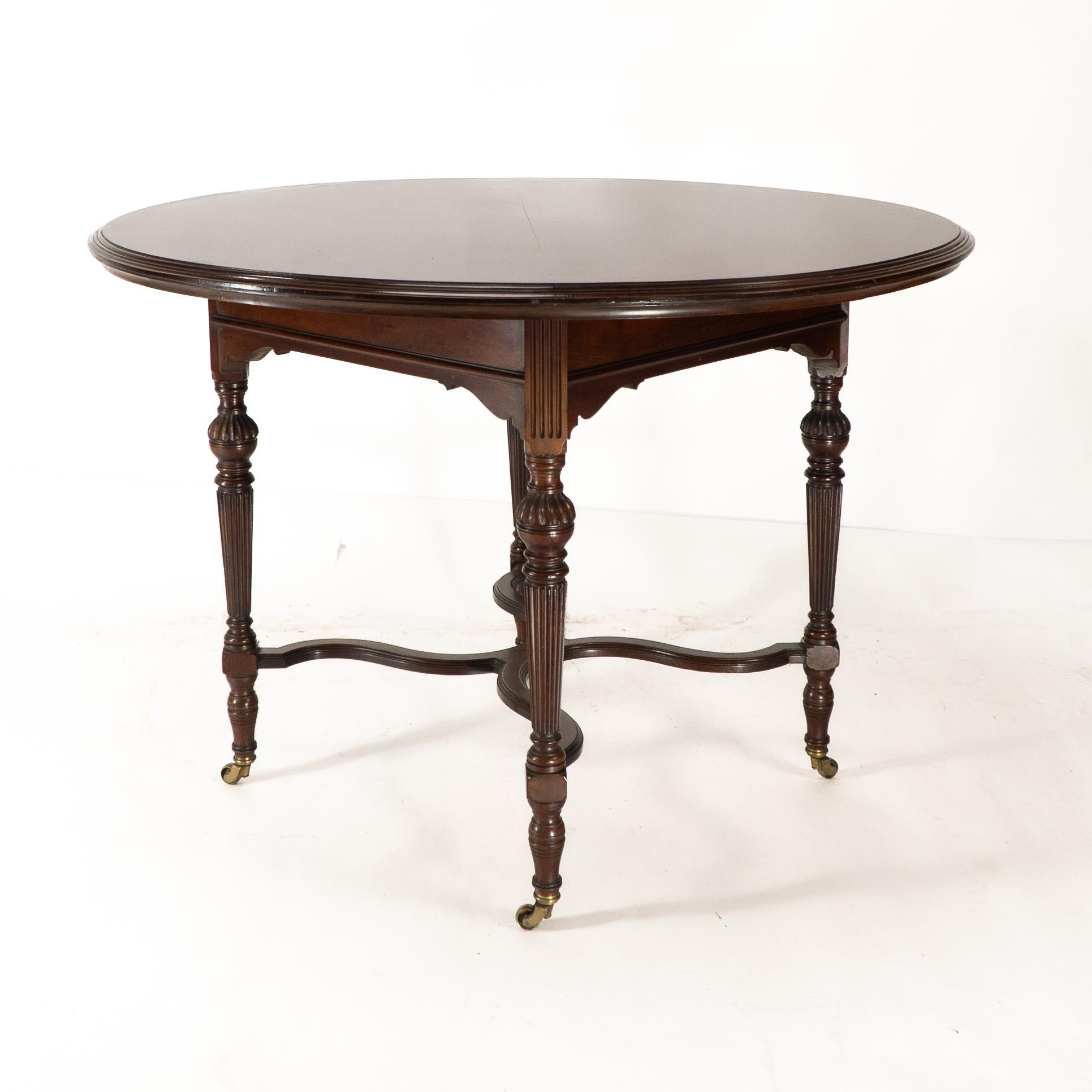 Walnut Collinson & Lock attributed. An Aesthetic Movement walnut circular center table For Sale