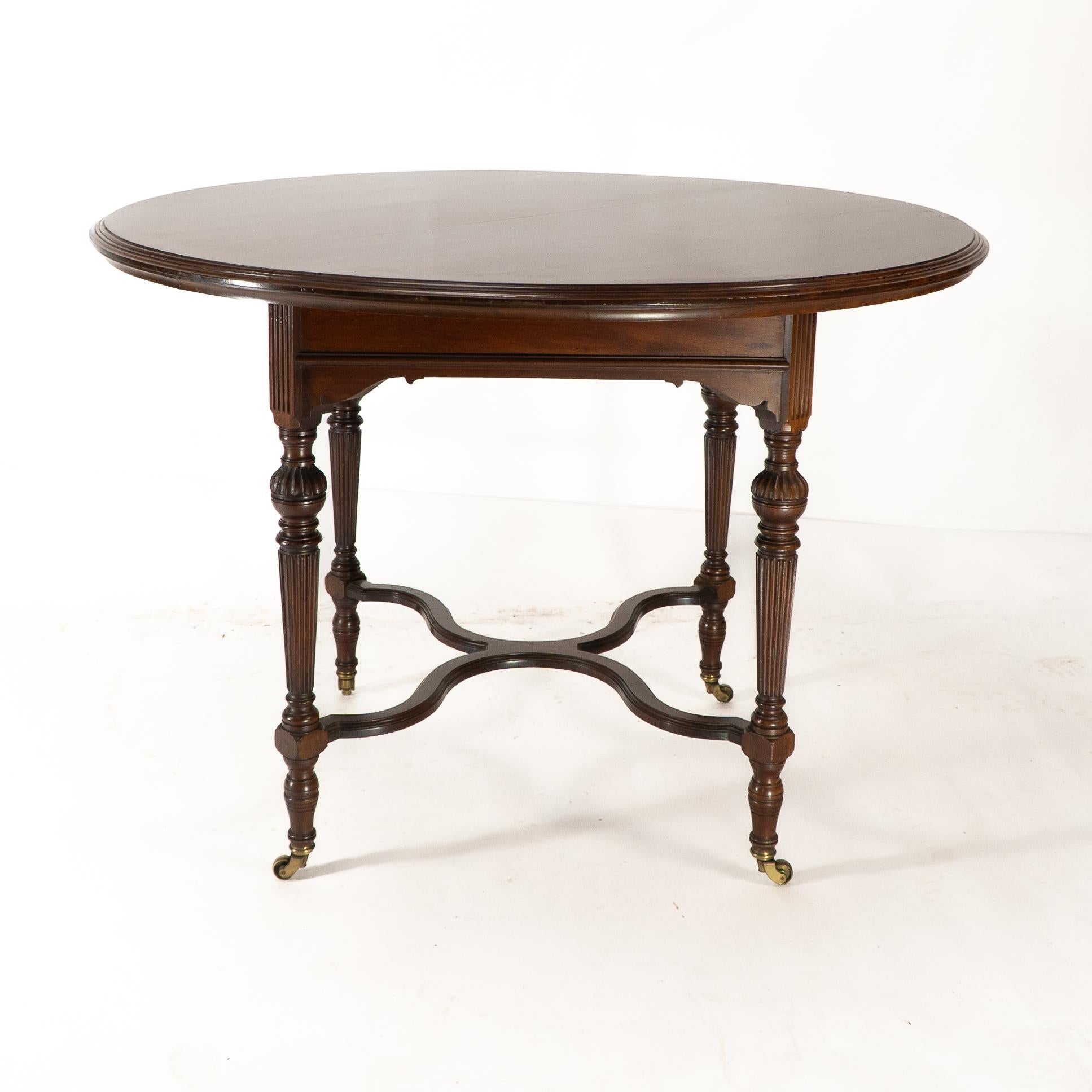 Collinson & Lock attributed. An Aesthetic Movement walnut circular center table For Sale 1