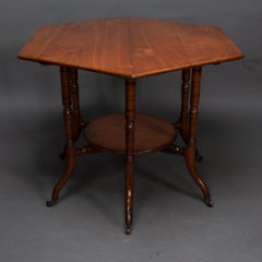 Collinson & Lock attributed. An Aesthetic Movement walnut octagonal center table