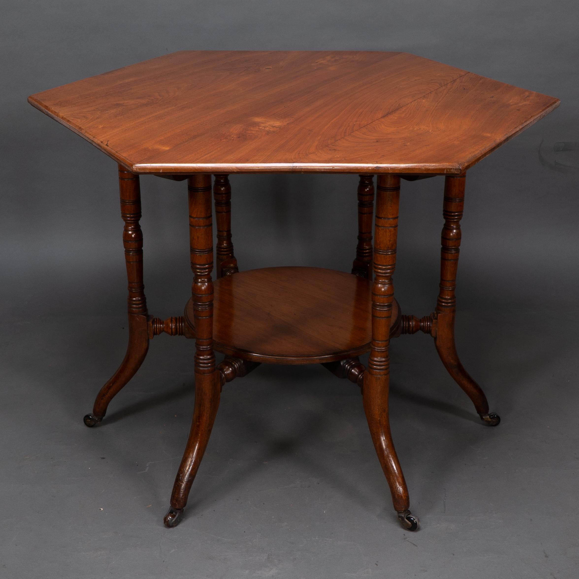 English Collinson & Lock attributed. An Aesthetic Movement walnut octagonal center table For Sale