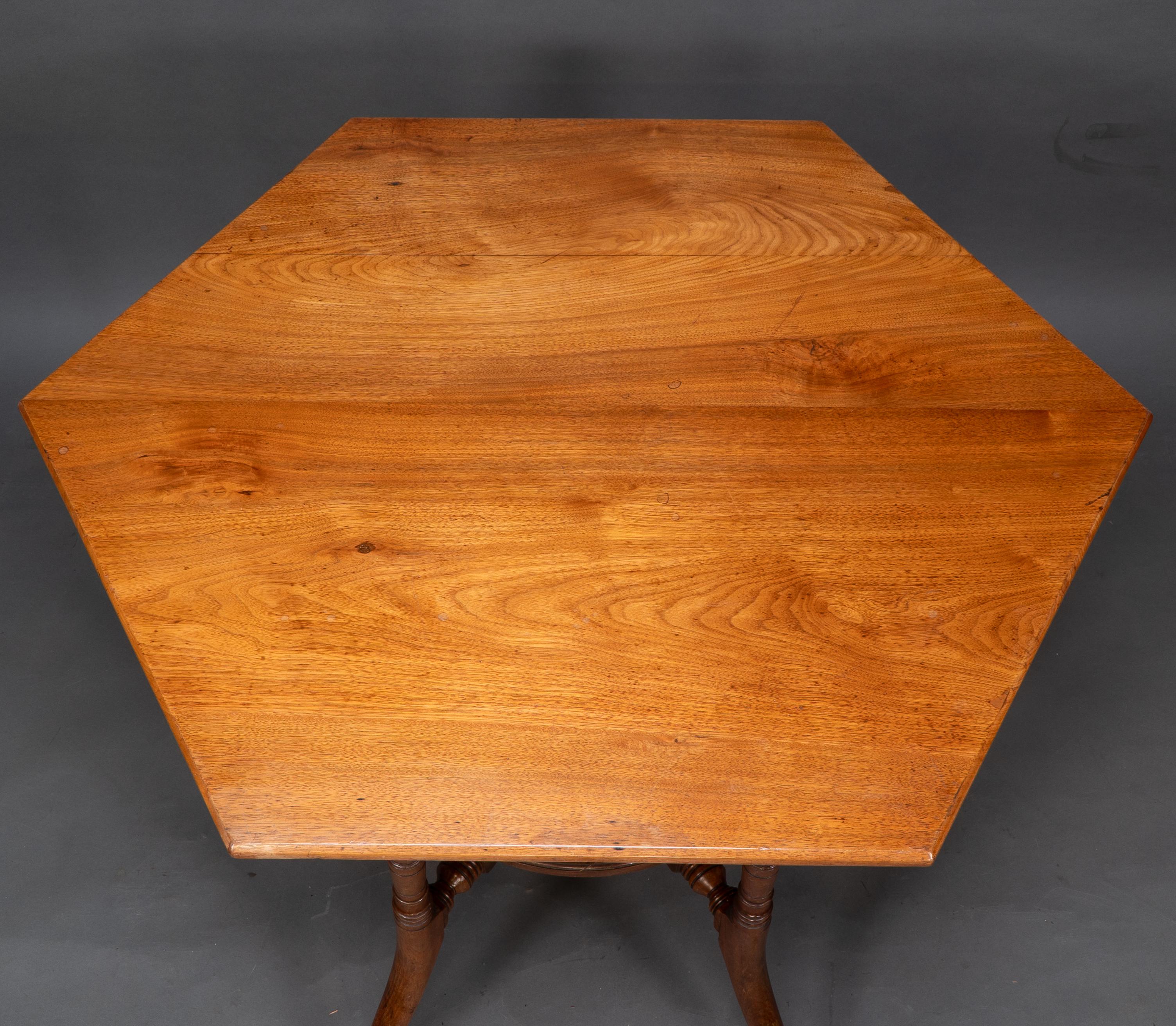 Walnut Collinson & Lock attributed. An Aesthetic Movement walnut octagonal center table For Sale