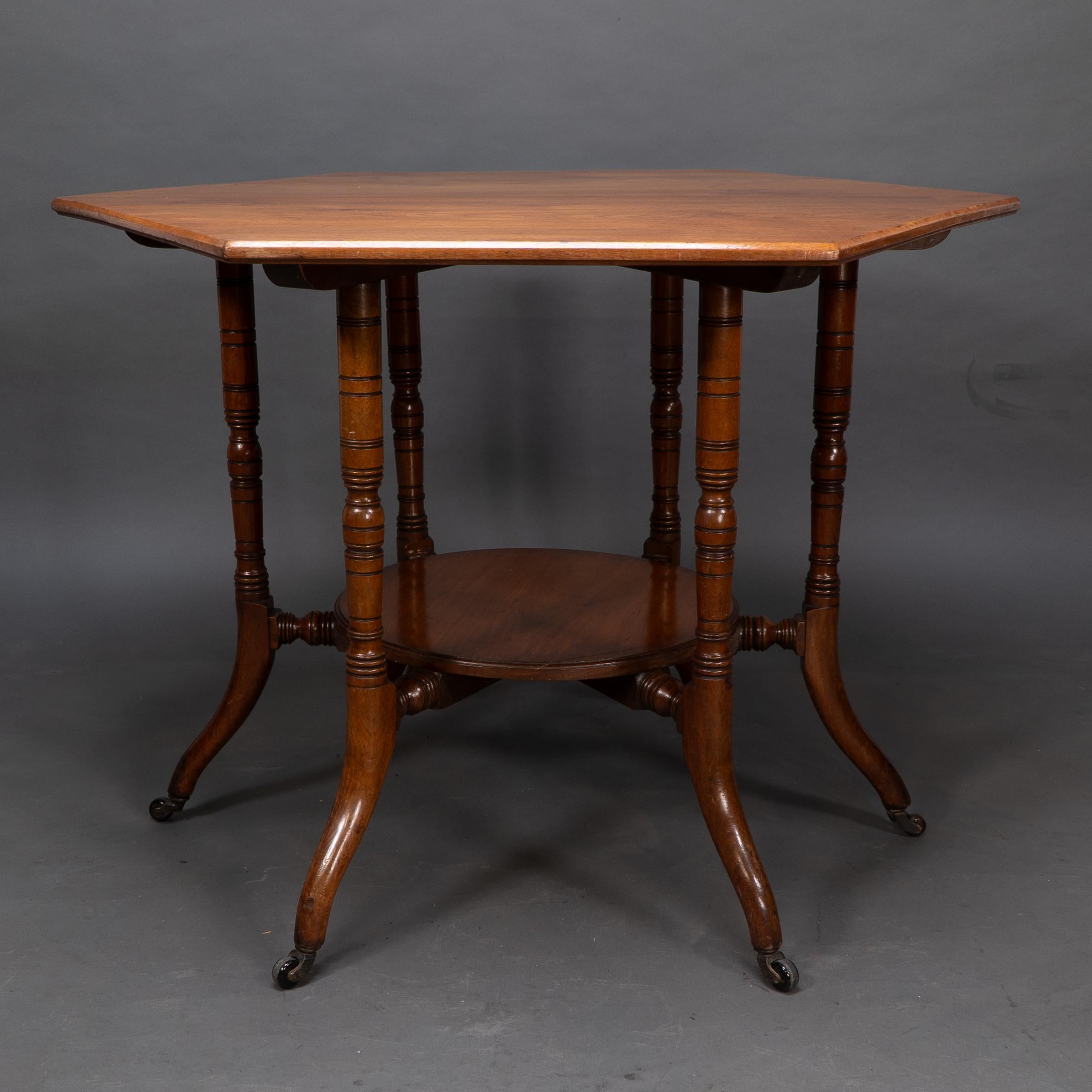 Collinson & Lock attributed. An Aesthetic Movement walnut octagonal center table For Sale 1