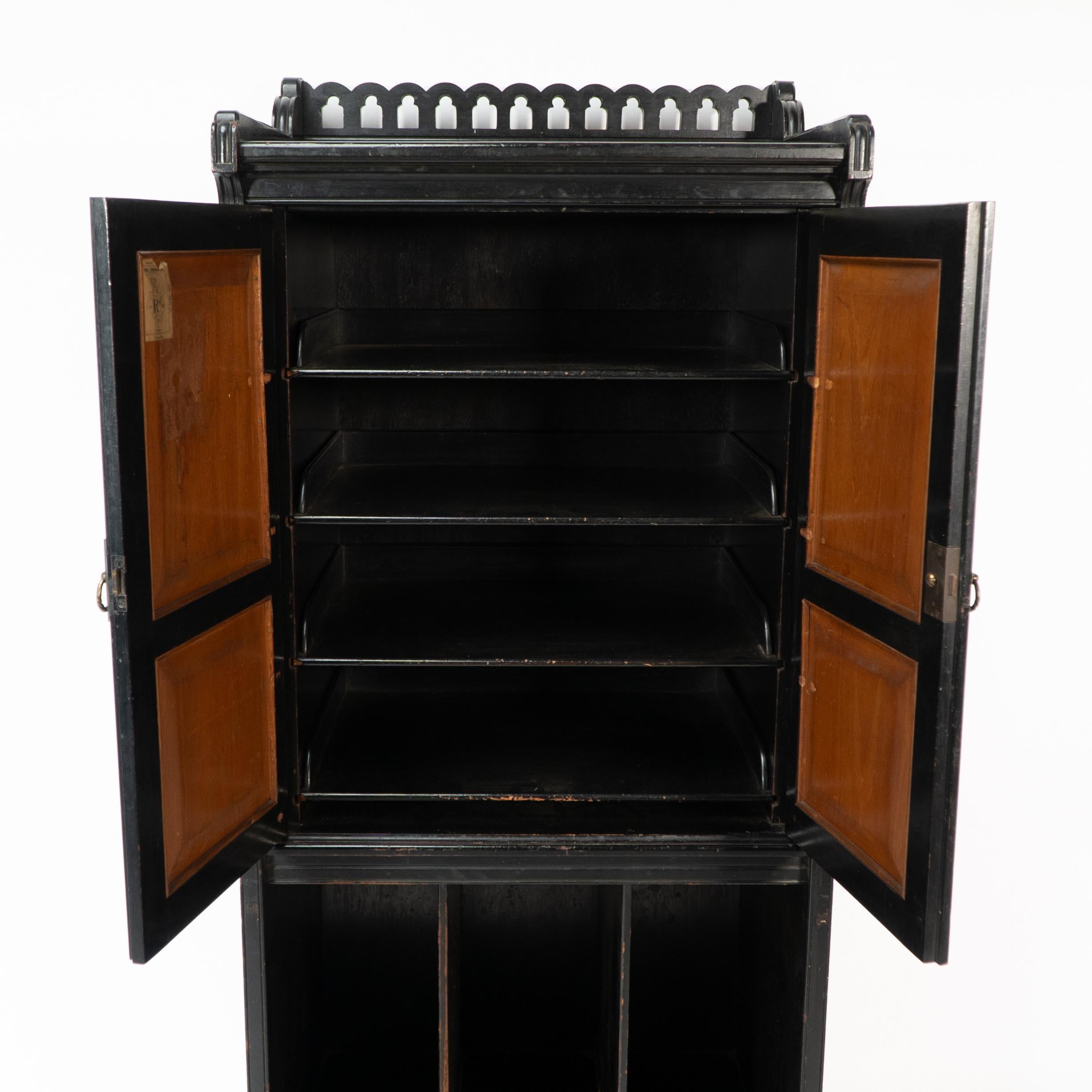 Collinson & Walton. An Aesthetic Movement burr walnut & ebonized music cabinet For Sale 3