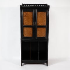 Collinson y Walton. Un mueble de música del Aesthetic Movement en nogal y ebonizado