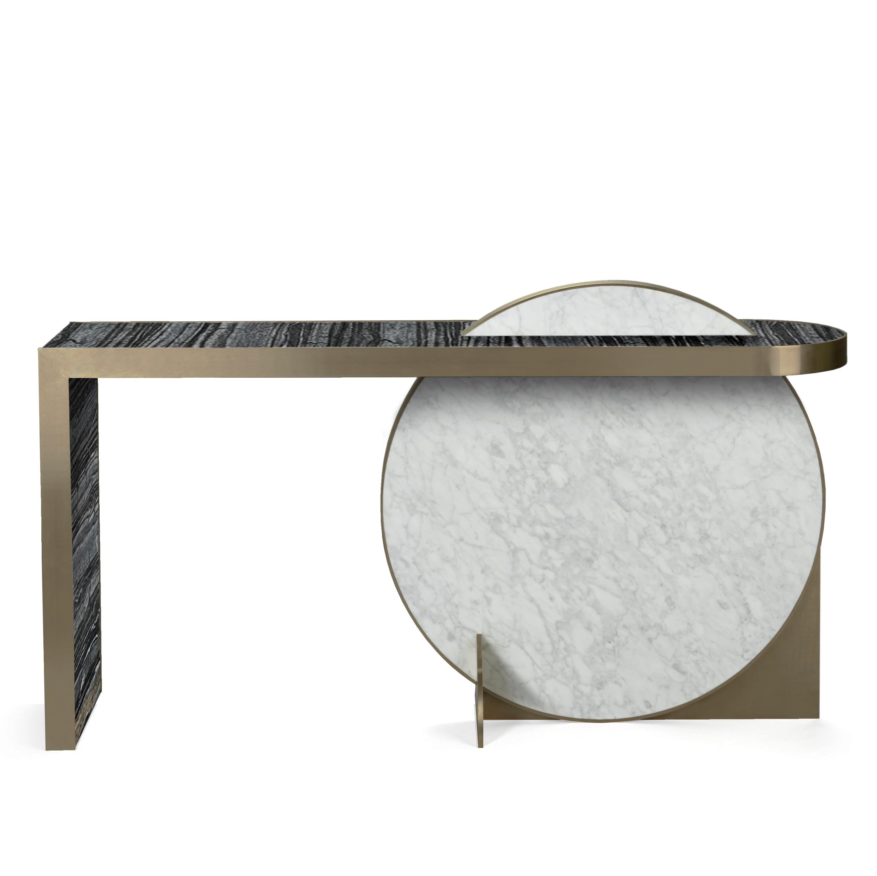 Collision console designed by Lara Bohinc for Bohinc Studio. The disk shape of this piece is inspired by the planets as part of the Lunar collection. The table is dynamically constructed using marble and brass revealing a refined luxury that